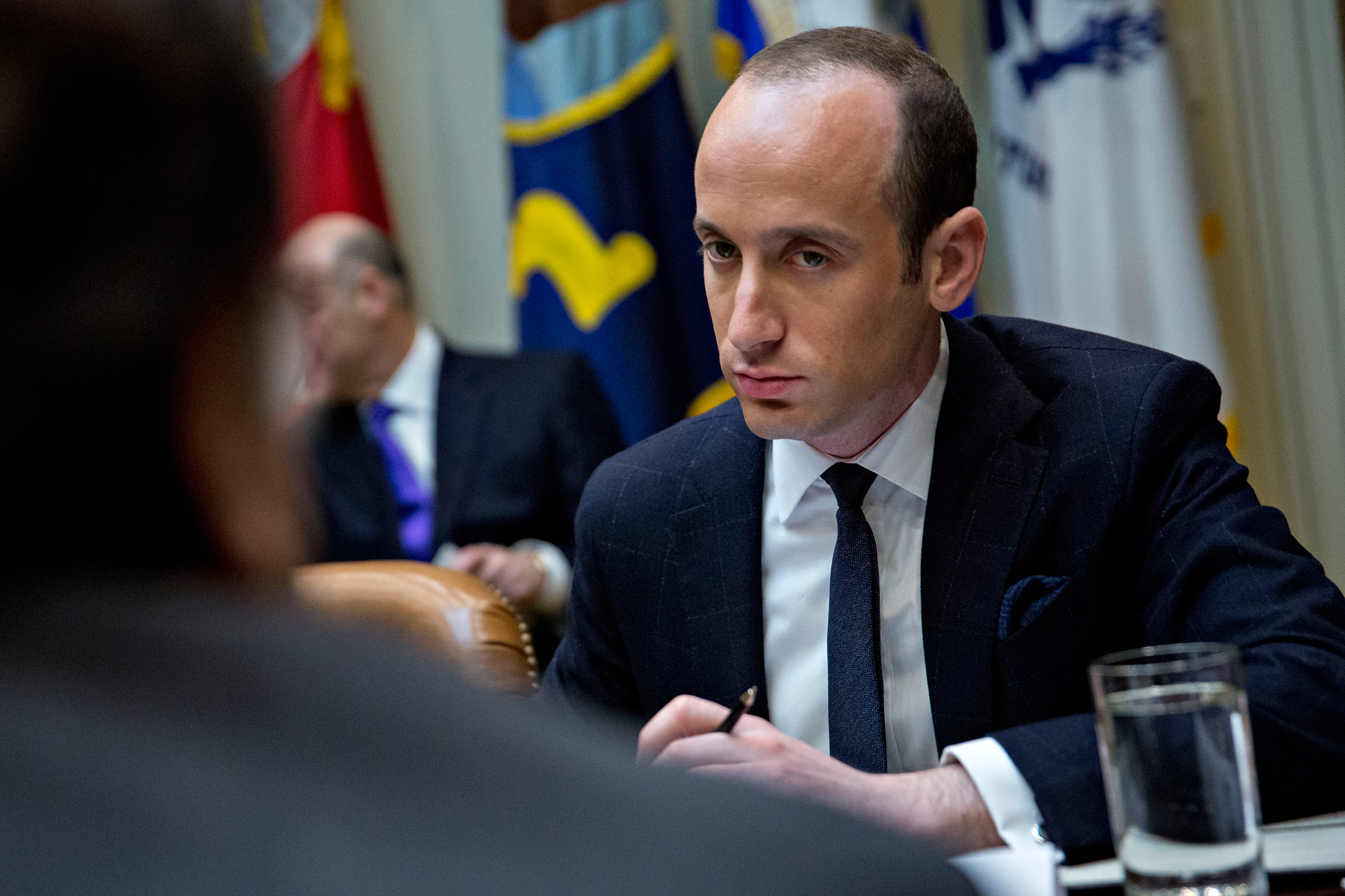 Stephen Miller, White House senior advisor for policy, right, listens as Roger Campos, with the Minority Business Roundtable, during a meeting of small business leaders with U.S. President Donald Trump, not pictured, in the Roosevelt Room of the White Ho