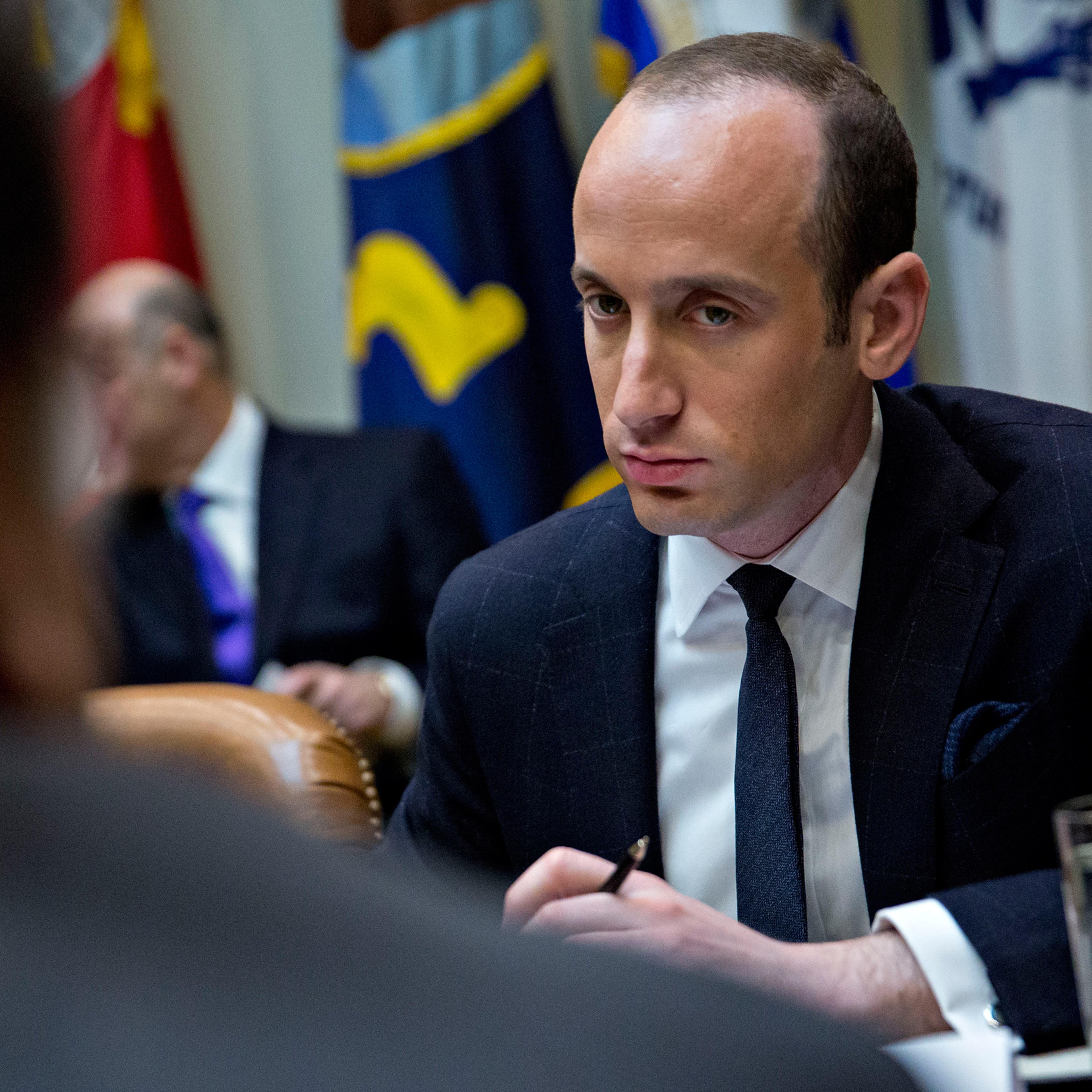 Stephen Miller, White House senior advisor for policy, right, listens as Roger Campos, with the Minority Business Roundtable, during a meeting of small business leaders with U.S. President Donald Trump, not pictured, in the Roosevelt Room of the White Ho