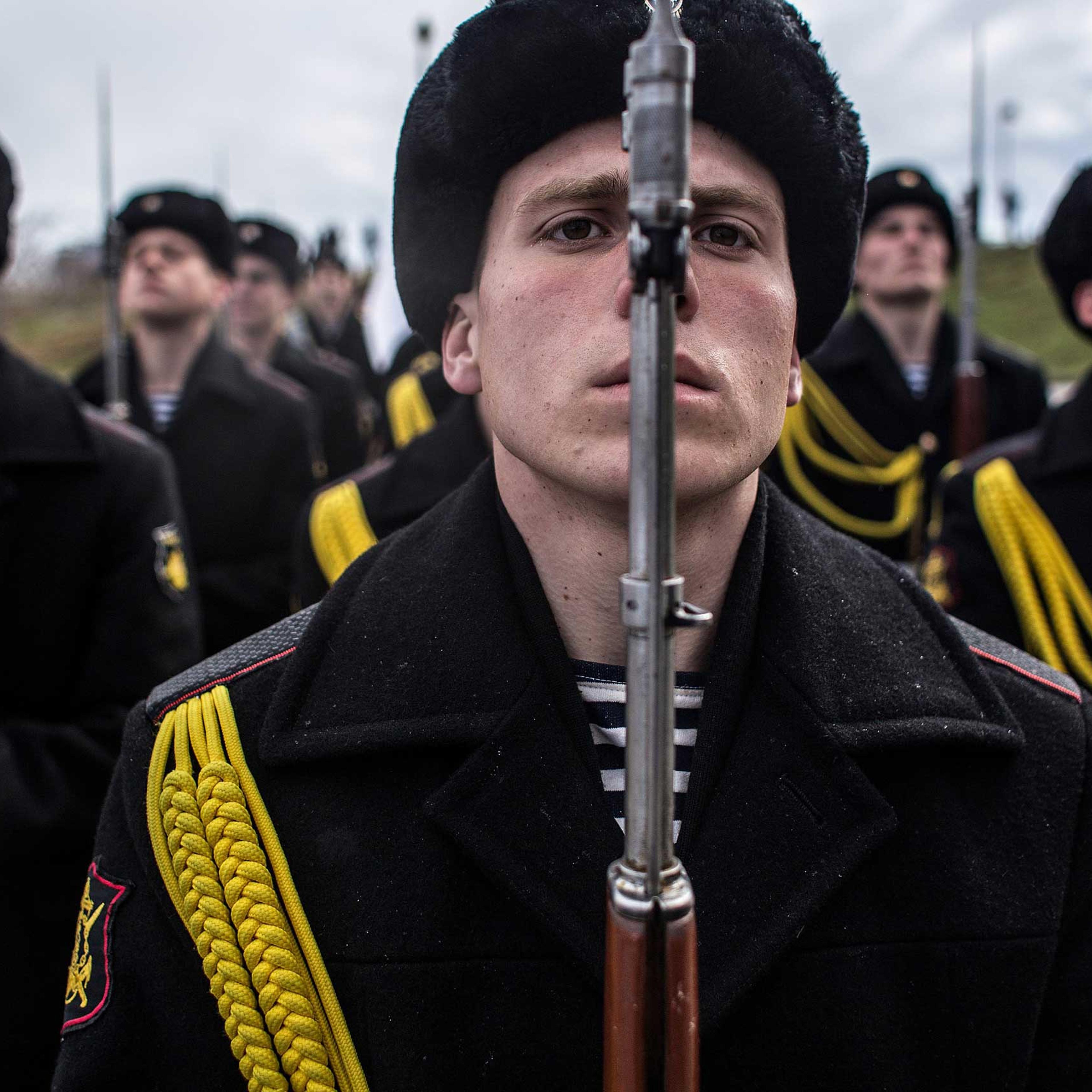 Soldiers of the honor guard prepare to march as people celebrate the first anniversary of the signing of the decree on the annexation of the Crimea by the Russian Federation, on March 18, 2014 in Sevastopol, Crimea.
