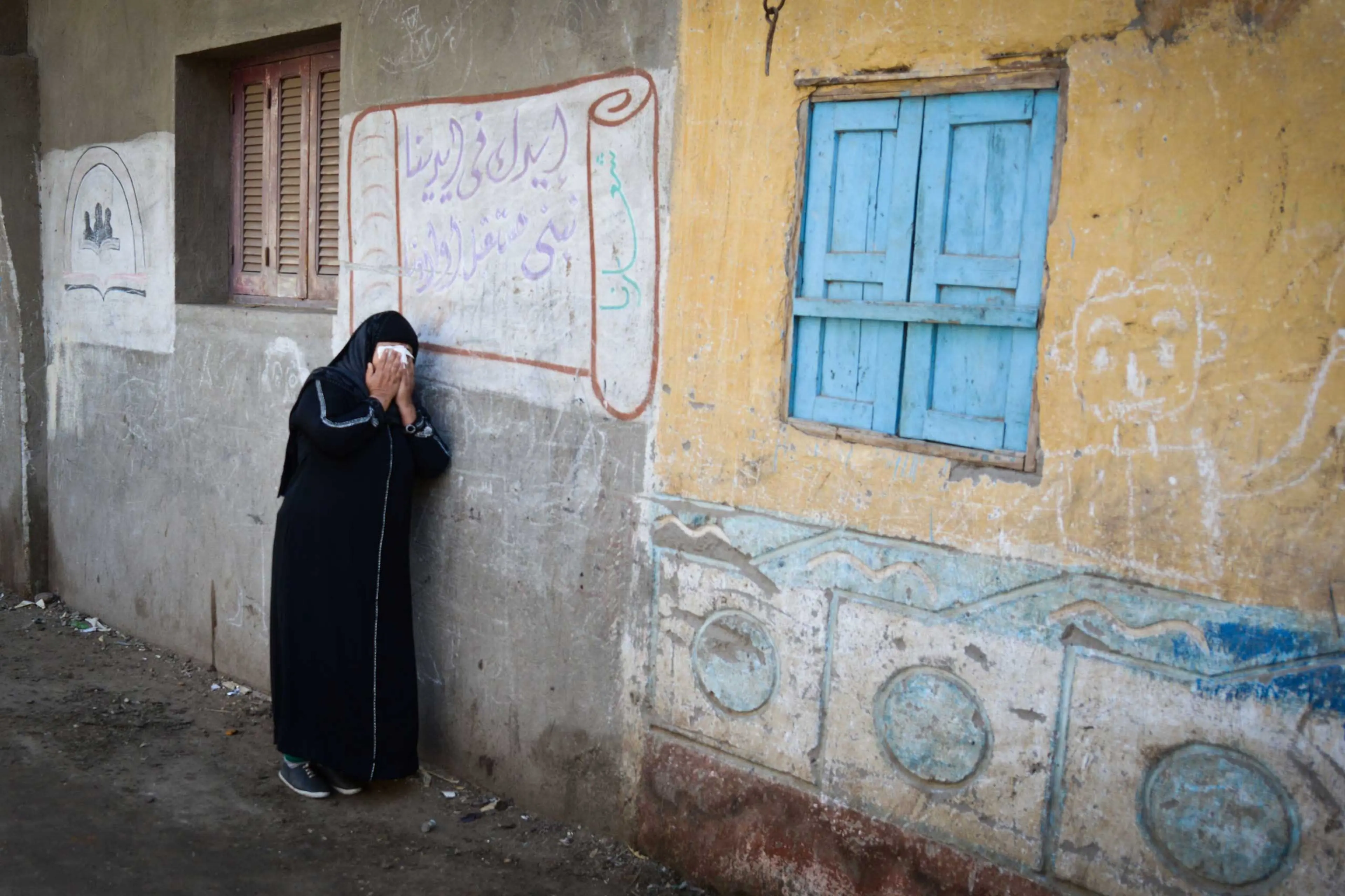 A relative of one of the Egyptian Coptic Christians purportedly killed by ISIS militants in Libya reacts after hearing the news on Feb. 16, 2015 in the village of Al-Awar in Egypt's southern province of Minya.