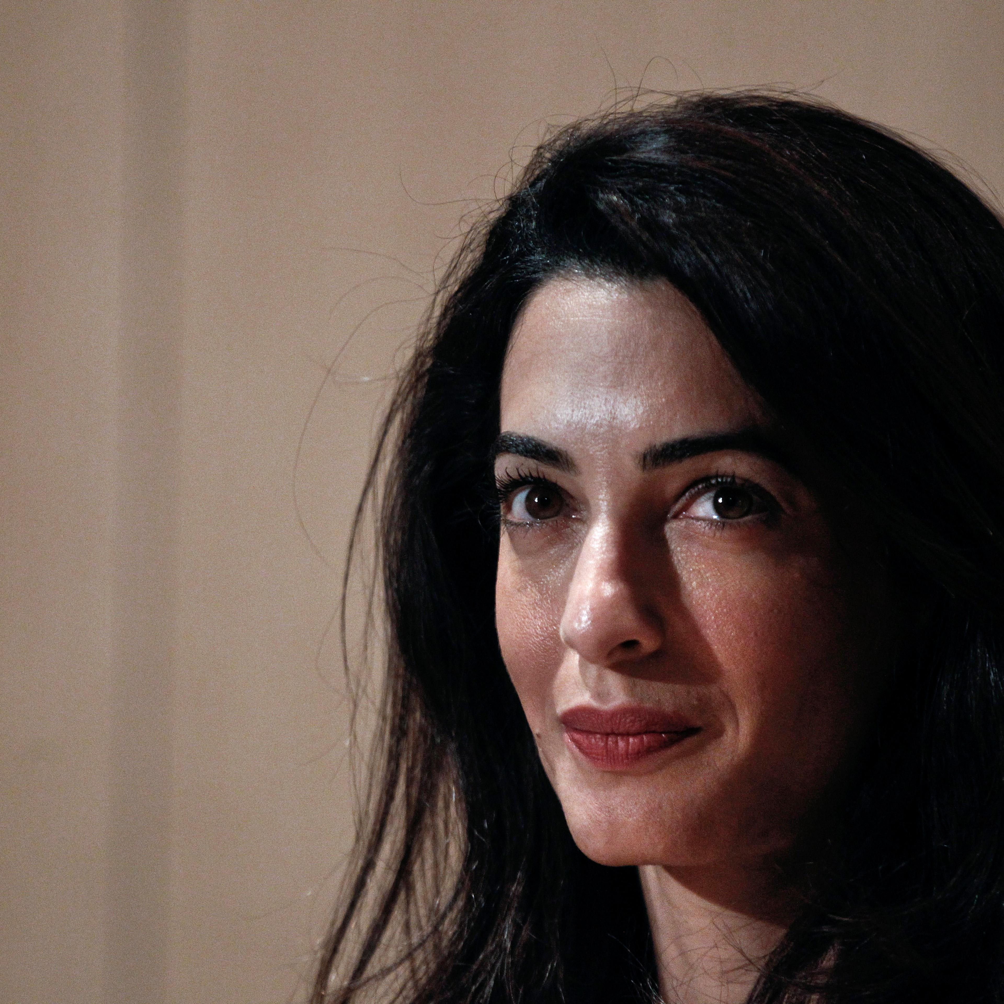 Human rights lawyer Amal Alamuddin Clooney looks on during a news conference at the Acropolis museum in Athens
