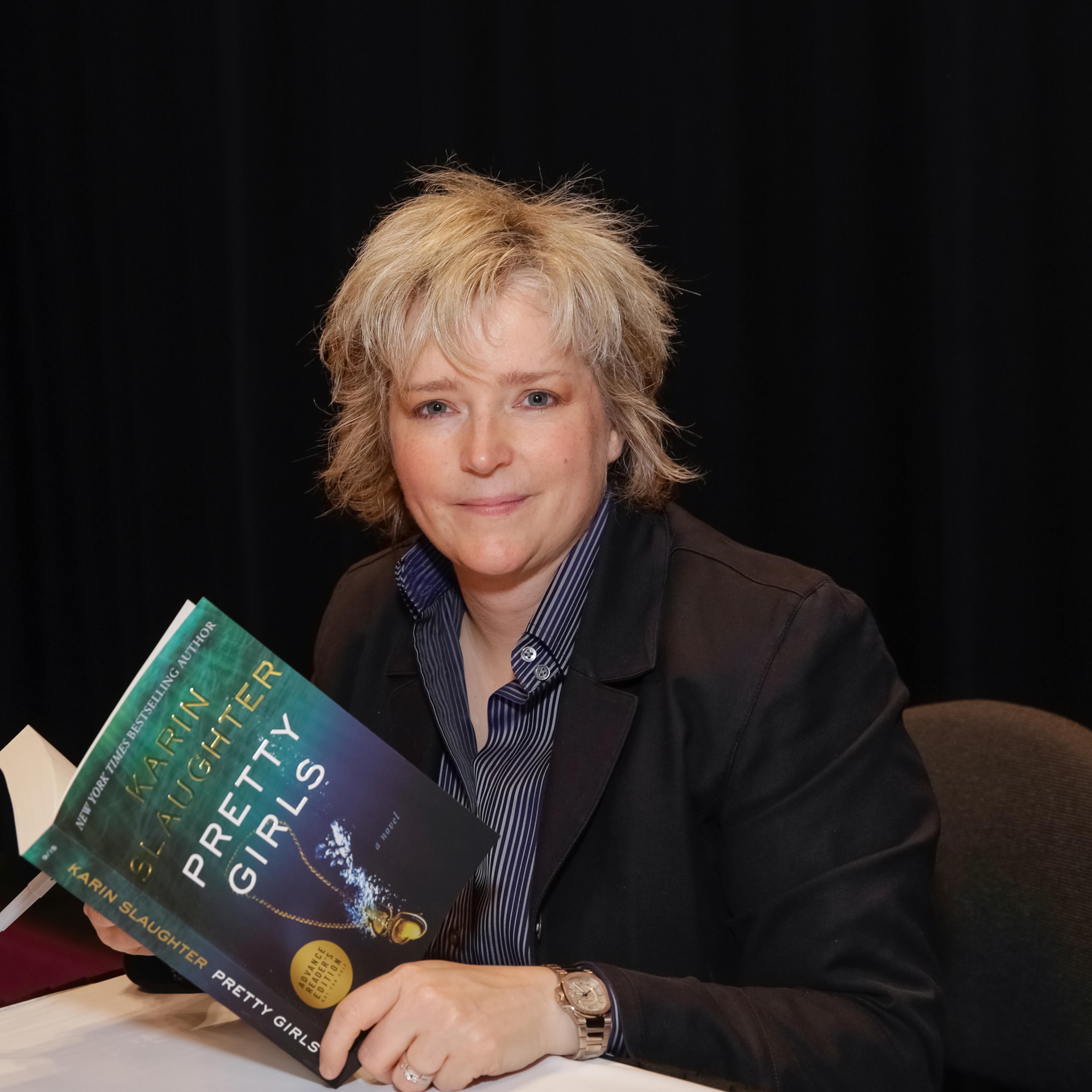 Author Karin Slaughter poses for photographs with her newest book during BookExpo America in New York City on May 27, 2015.