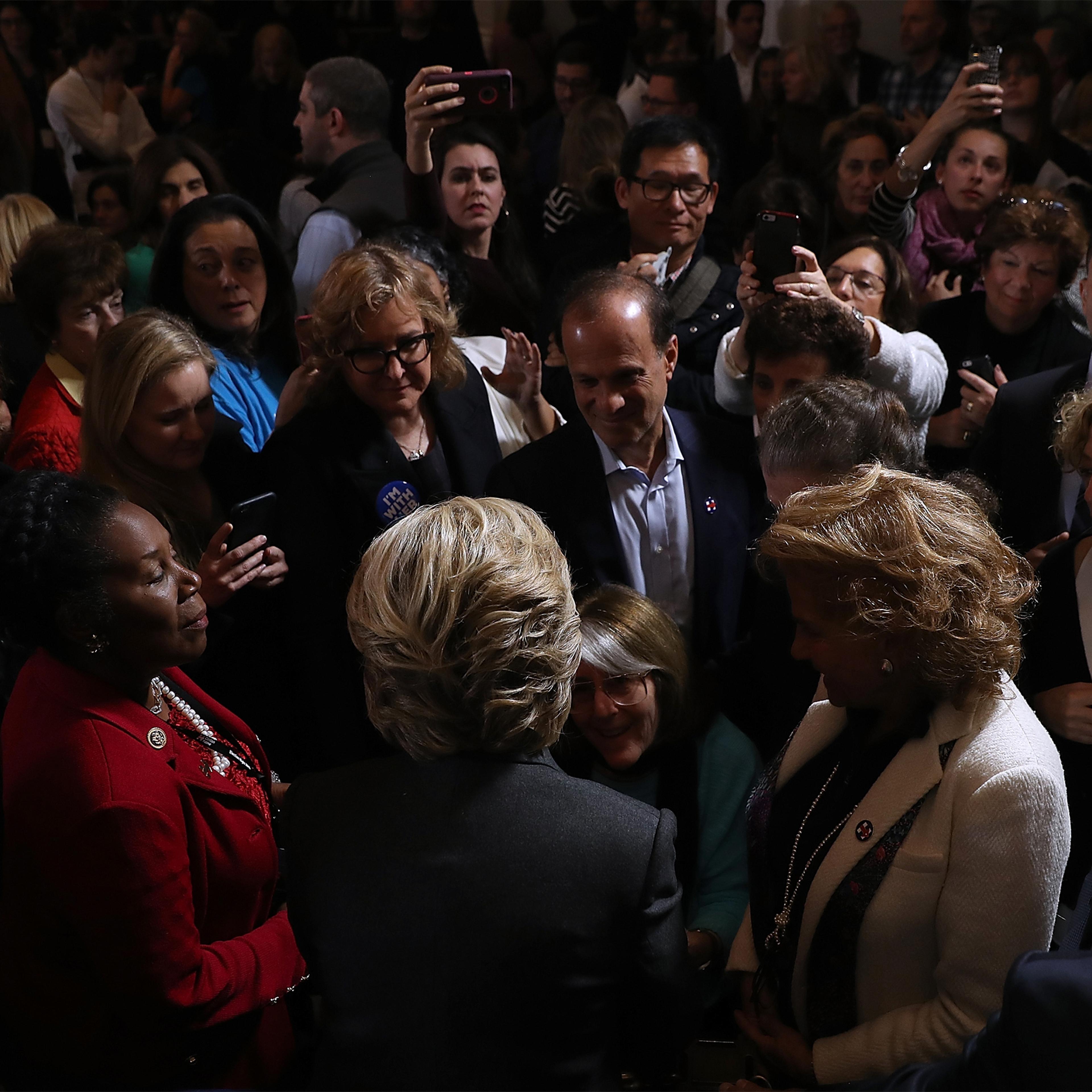 Former Secretary of State Hillary Clinton greets supporters and members of her staff during a news conference at the New Yorker Hotel on November 9, 2016 in New York City. Hillary Clinton conceded the U.S. Presidency to Republican challenger Donald Trump.