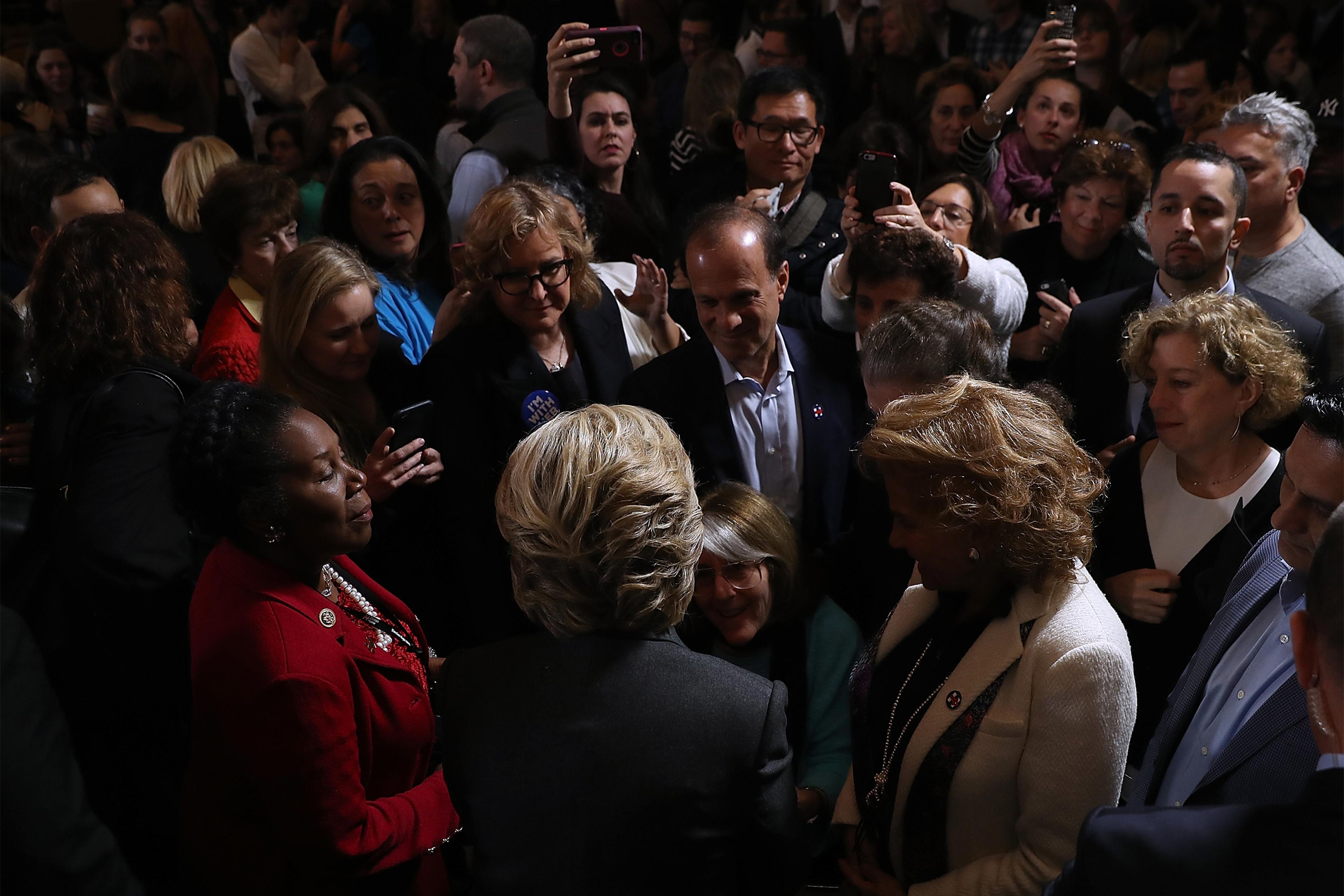 Former Secretary of State Hillary Clinton greets supporters and members of her staff during a news conference at the New Yorker Hotel on November 9, 2016 in New York City. Hillary Clinton conceded the U.S. Presidency to Republican challenger Donald Trump.