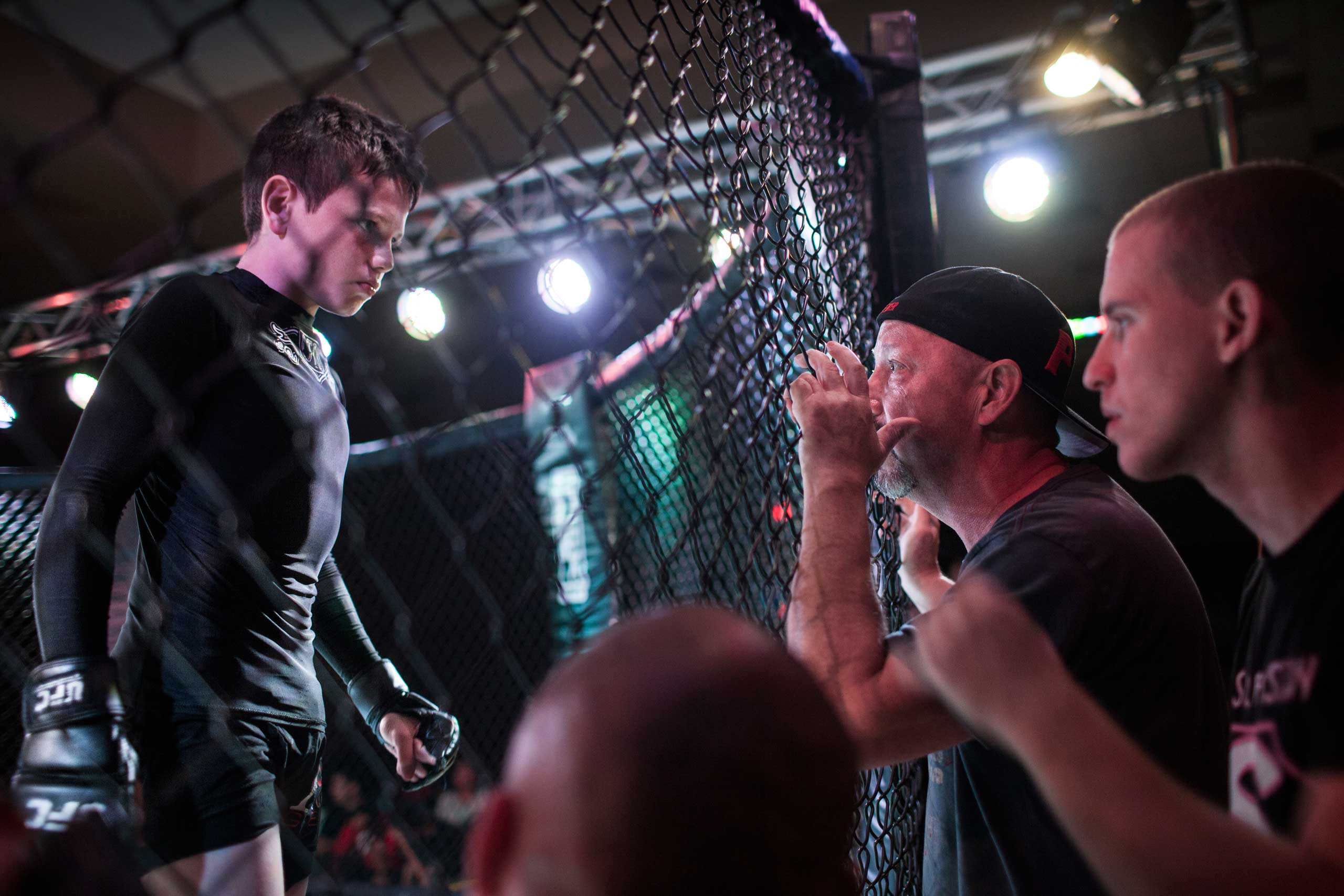 Mixed Martial Arts fighter Brock Locnikar, 8, in the octagon, takes precious advise from his corner men Clay Carpenter and Thiago Azeredo during United States Fight League(USFL) All-star Pankration show at Blue Water Casino in Parker, Arizona on 25th of 