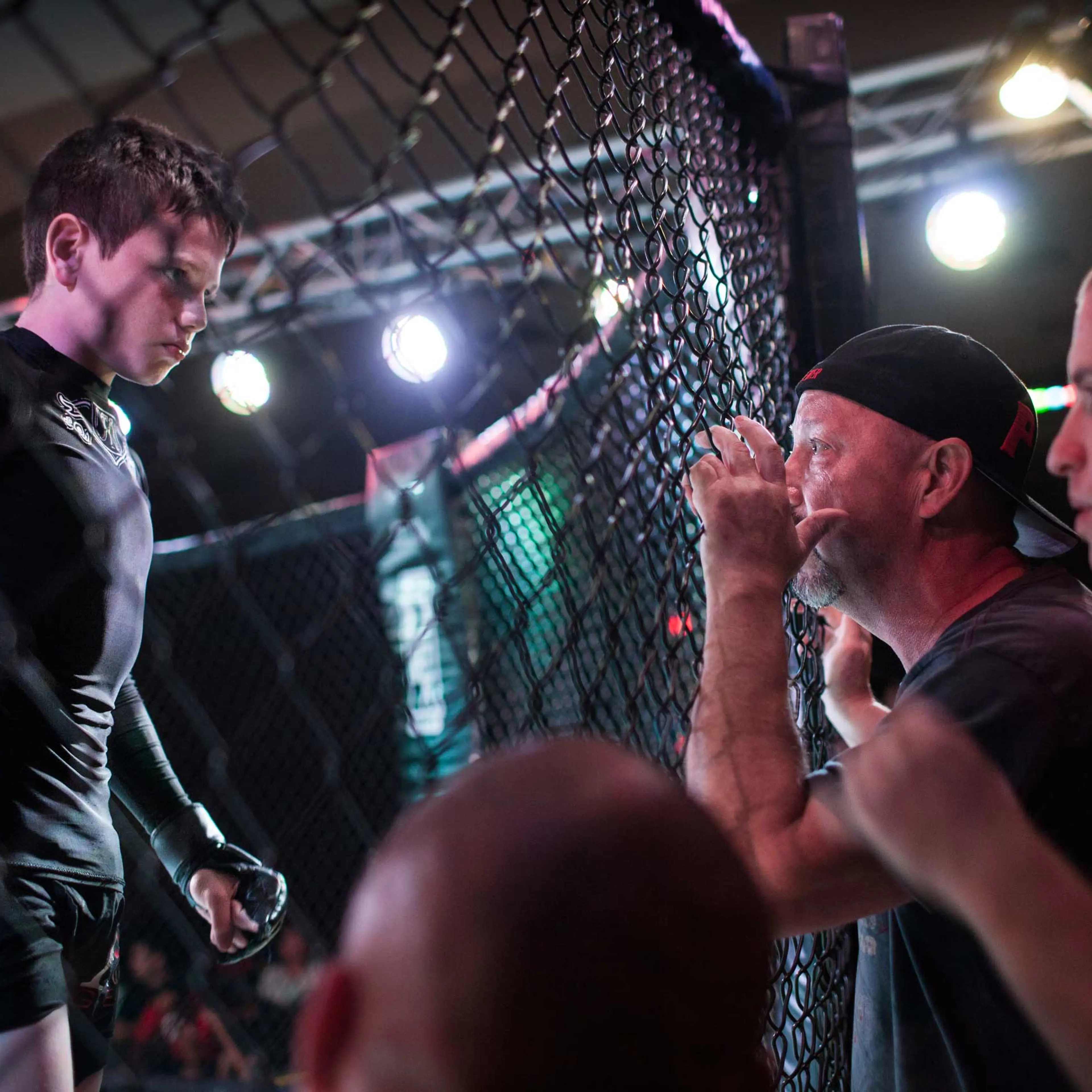 Mixed Martial Arts fighter Brock Locnikar, 8, in the octagon, takes precious advise from his corner men Clay Carpenter and Thiago Azeredo during United States Fight League(USFL) All-star Pankration show at Blue Water Casino in Parker, Arizona on 25th of