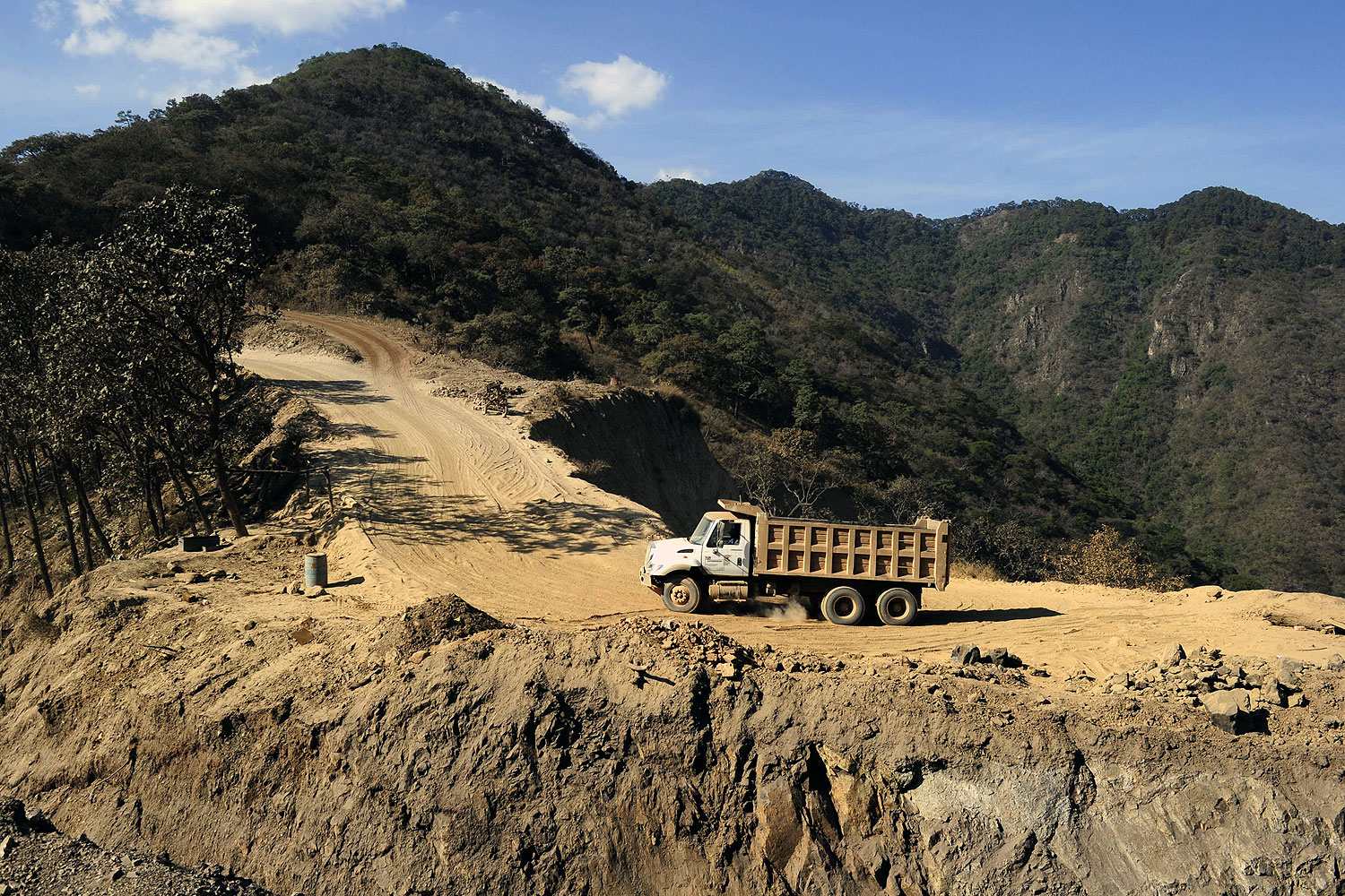 A truck clibs a road at a steel mine in the Aguililla community, in Michoacan State, Mexico, on Feb. 14, 2014