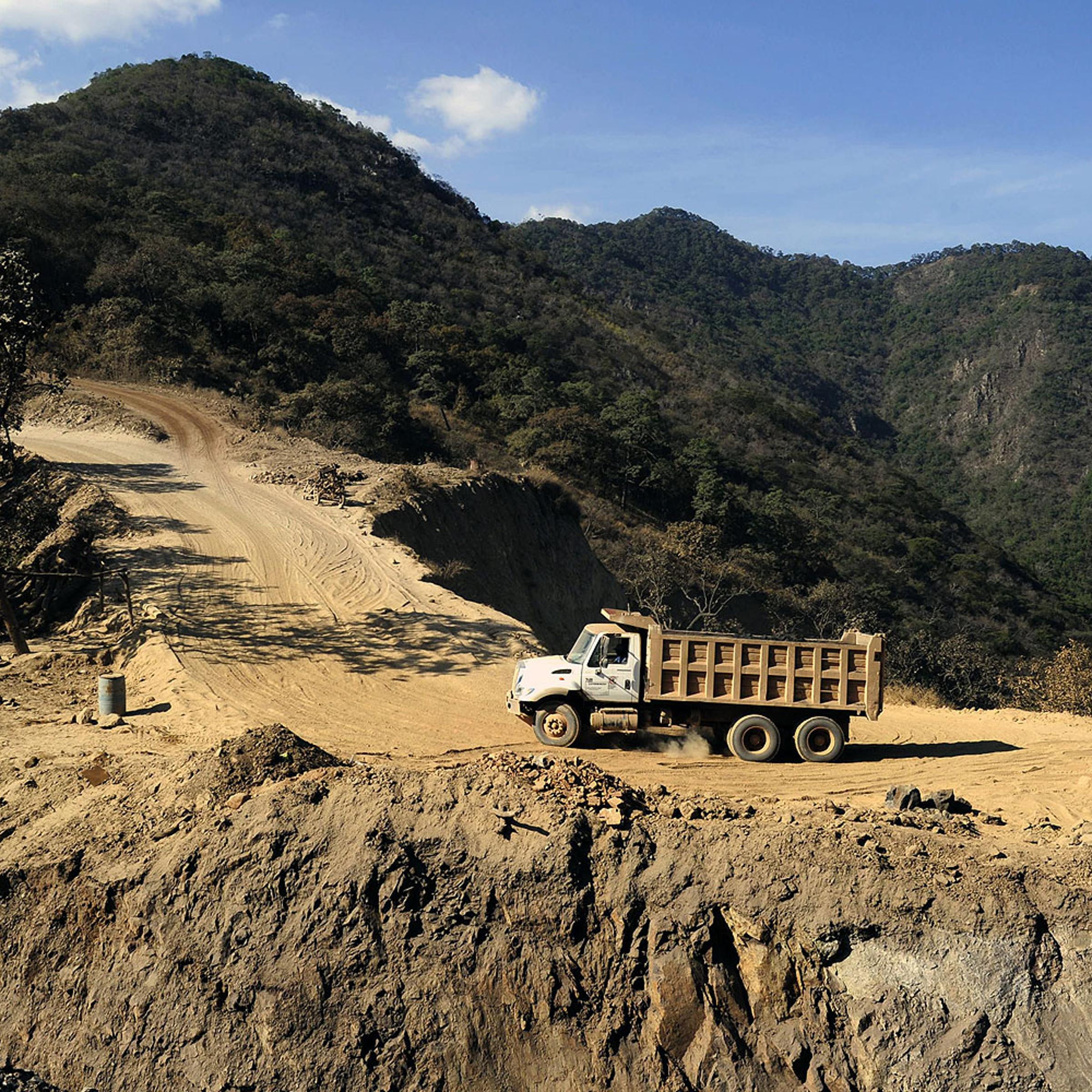 A truck clibs a road at a steel mine in the Aguililla community, in Michoacan State, Mexico, on Feb. 14, 2014