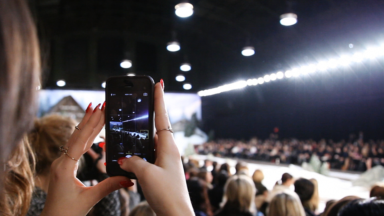 A member of the New York Fashion Week InstaMeet captures the first runway look of Tommy Hilfiger Women's Fall 2014 show. 