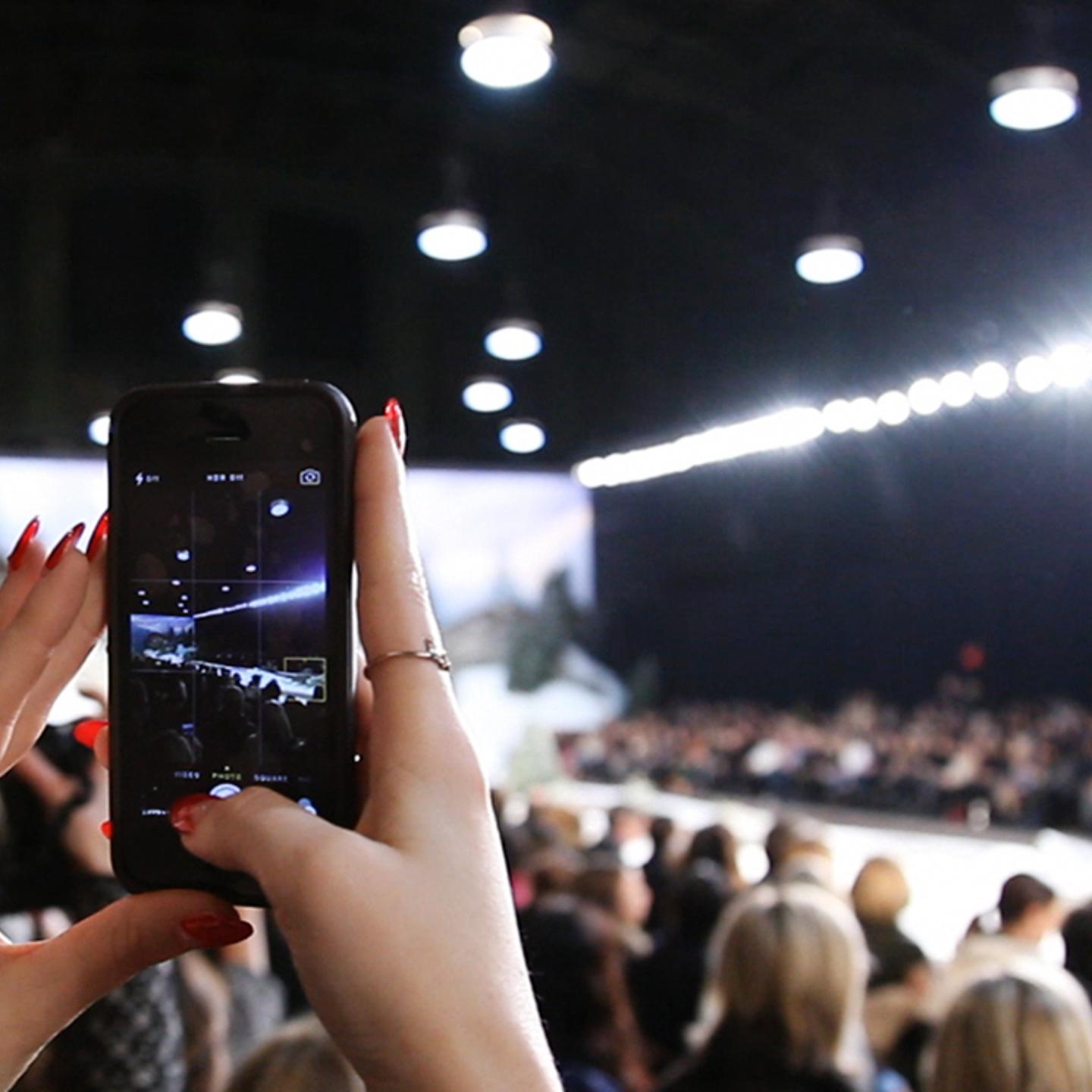 A member of the New York Fashion Week InstaMeet captures the first runway look of Tommy Hilfiger Women's Fall 2014 show.