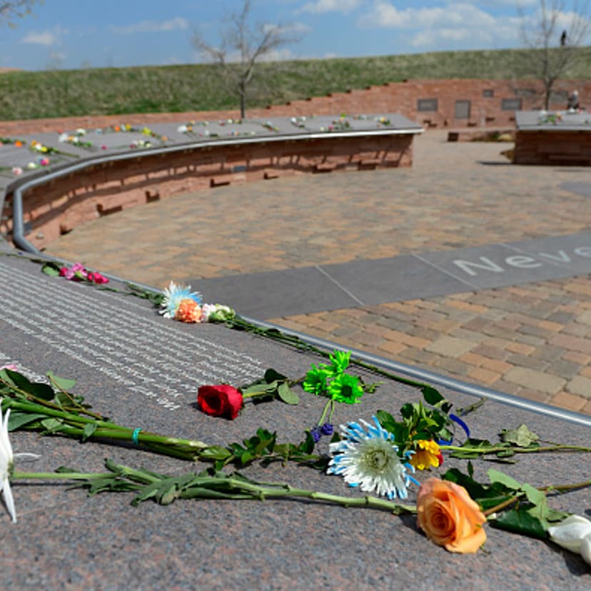 Visitors spend time at the Columbine Memorial on Monday, April 20, 2015.