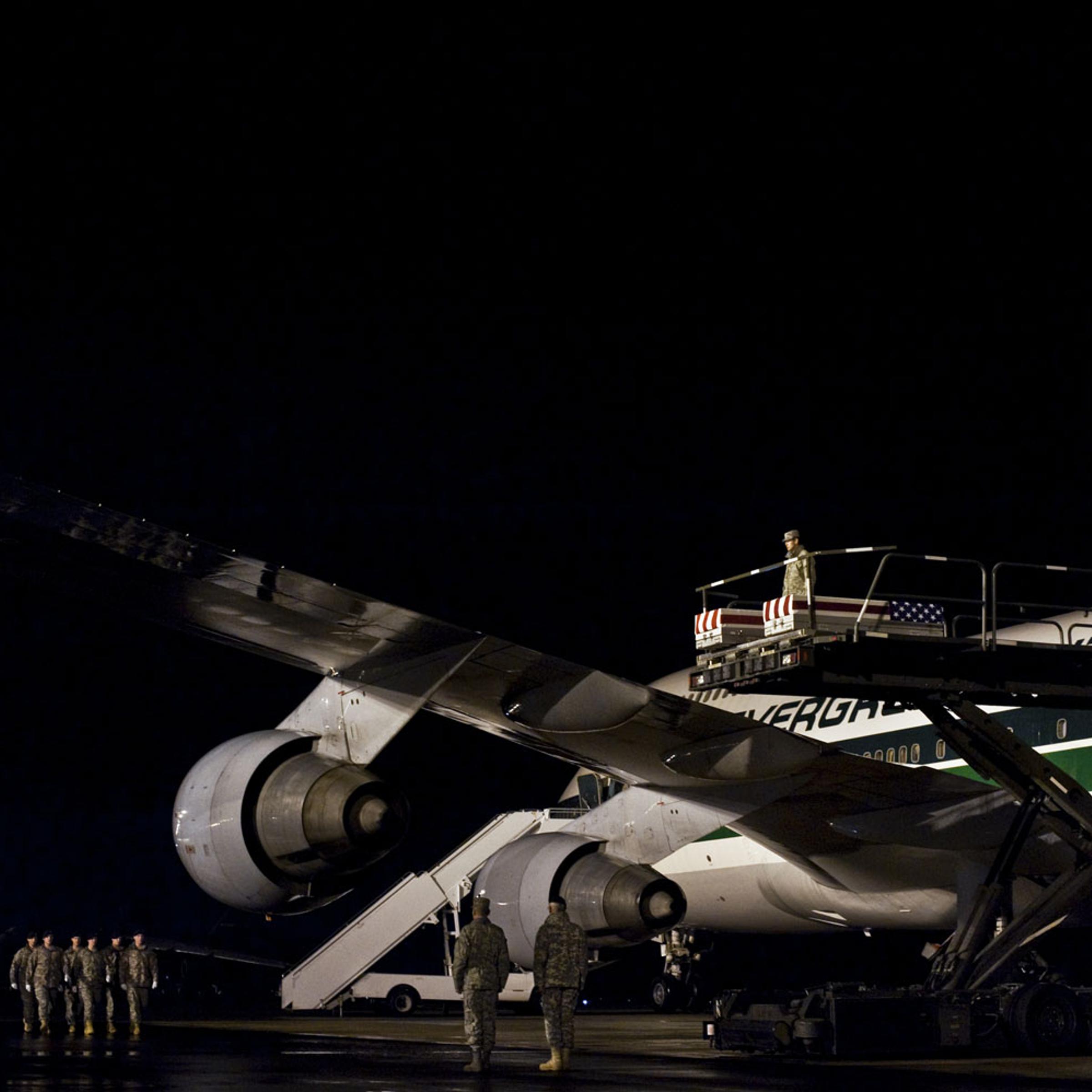 <b>Silent Night</b> <br>
The remains of Staff Sergeant William Ricketts, killed in Afghanistan, arrive at Dover Air Force Base on March 2. Sgt Ricketts, 27, was felled by small arms fire on February 27. On his fifth tour of duty in Iraq and Afghanistan, he had signed up for service on the day after the 9/11 attacks.