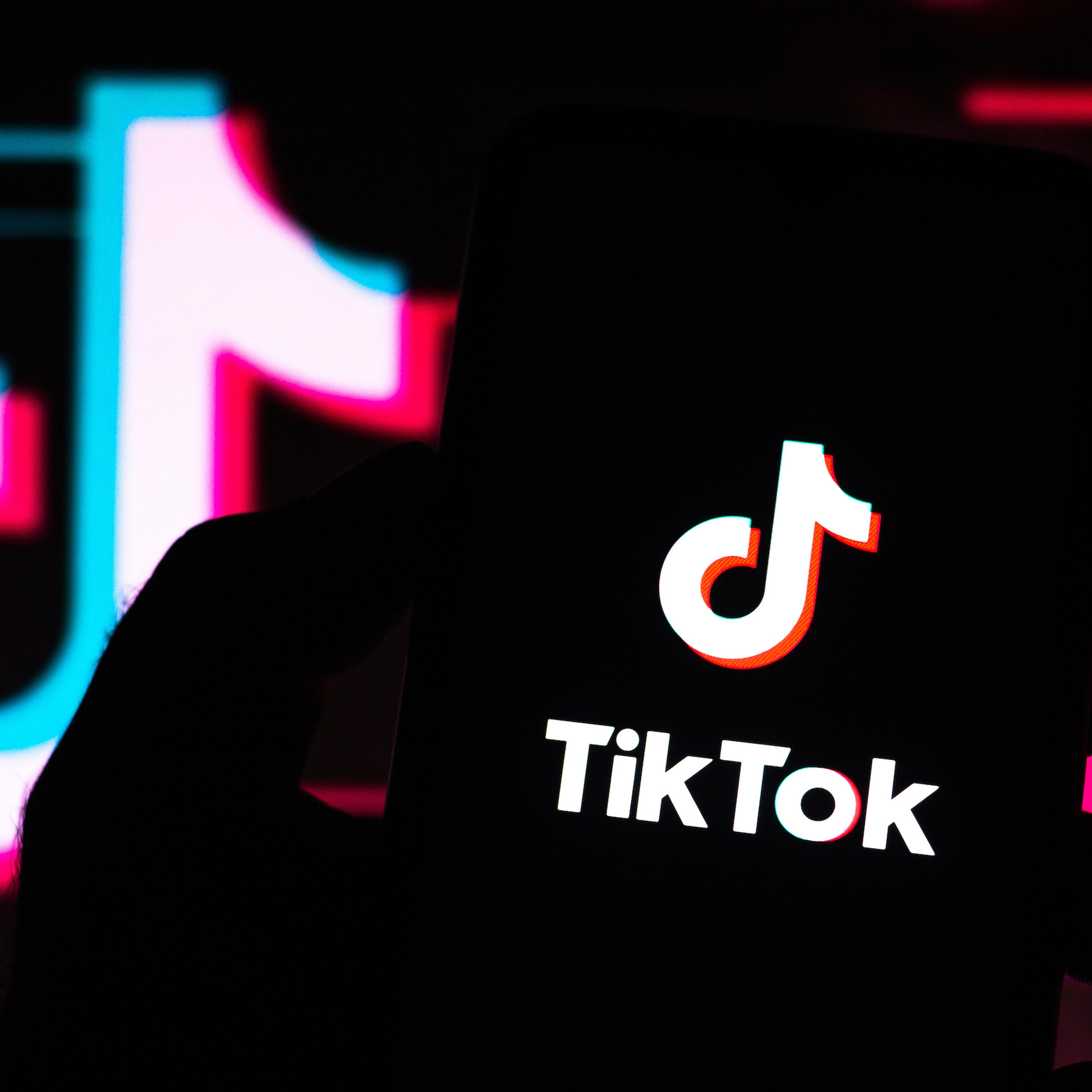 In this photo illustration a TikTok logo seen displayed on a smartphone.