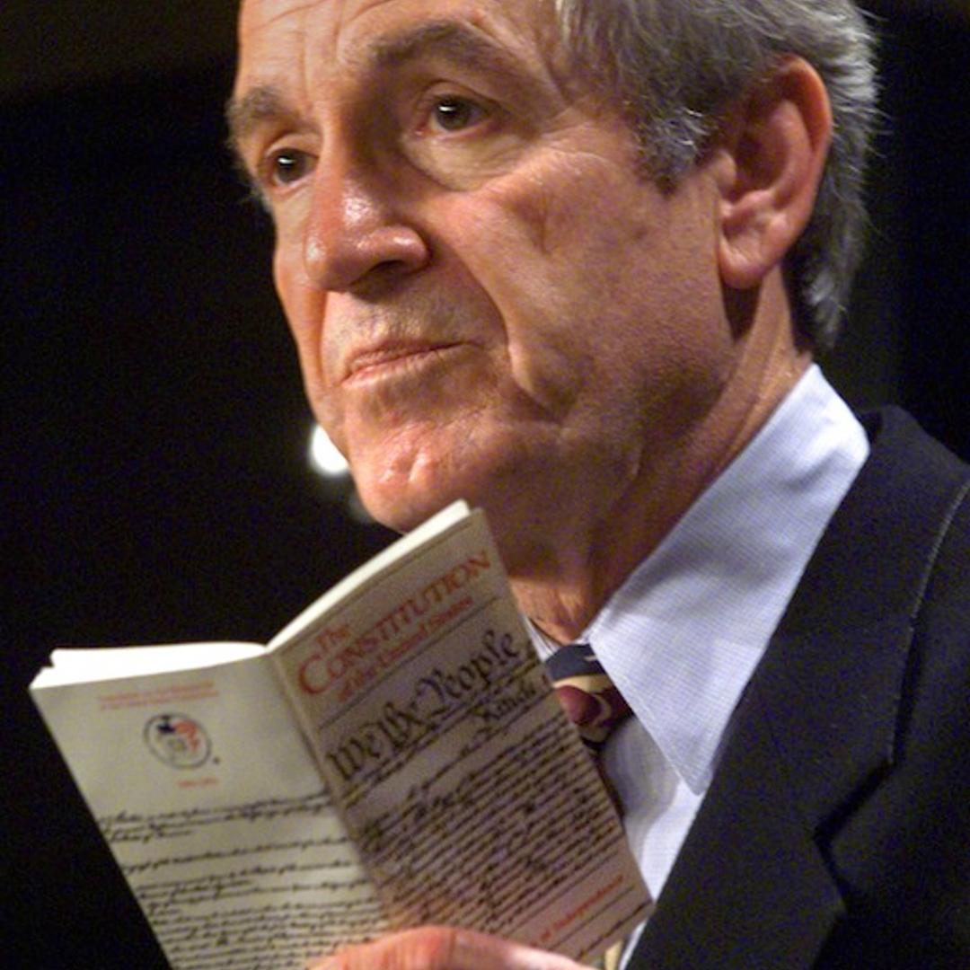 US Senator Tom Harkin(D-IA) waves a pocket copy of