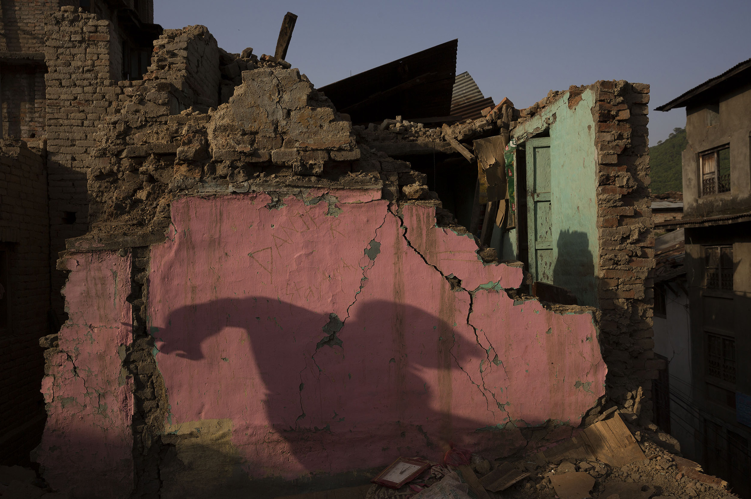 Nepal earthquake. Town of Sankhu. Mush of town was destroyed. People digging out their possessions. by James Nachtwey