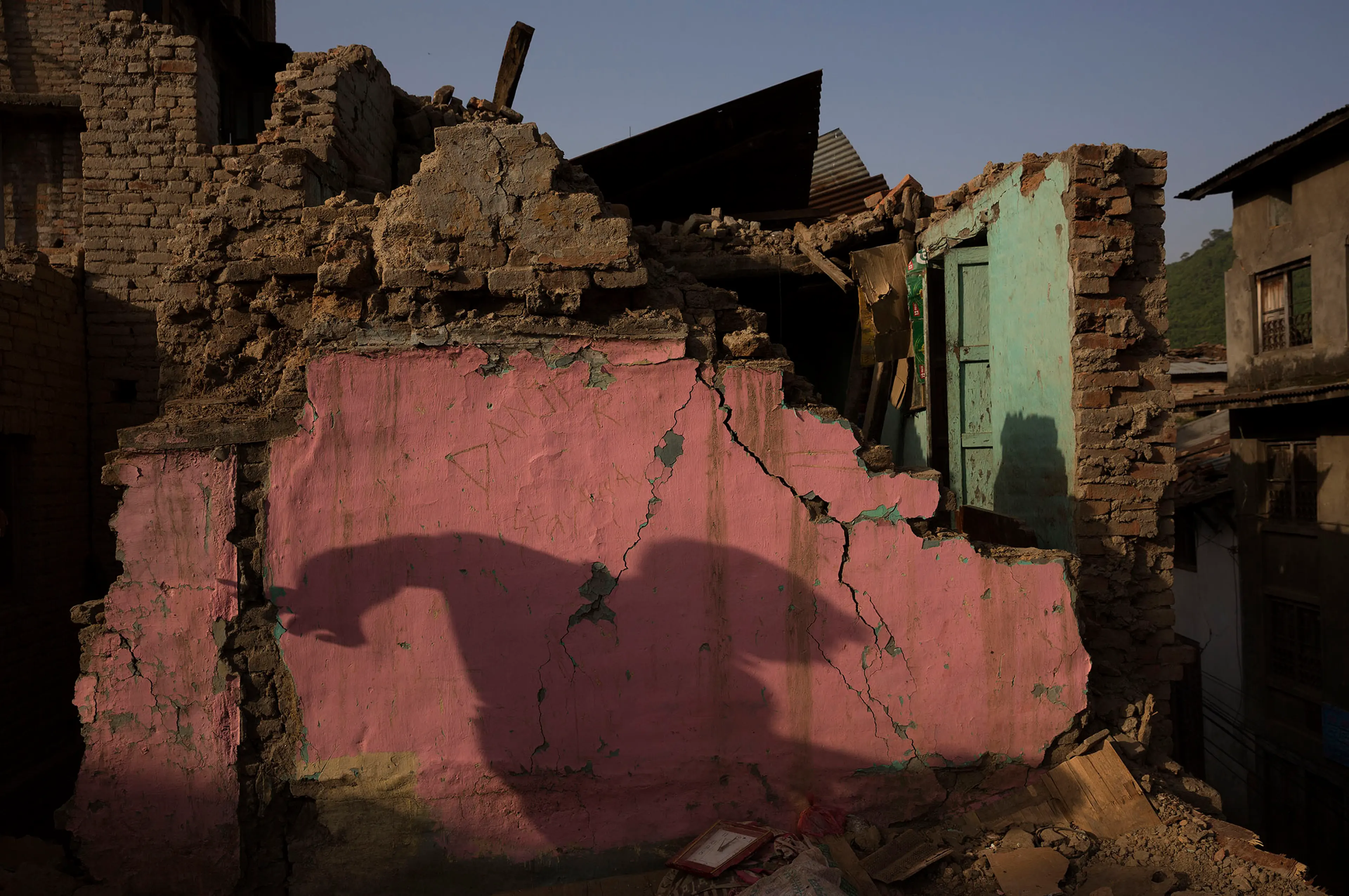 Nepal earthquake. Town of Sankhu. Mush of town was destroyed. People digging out their possessions. by James Nachtwey
