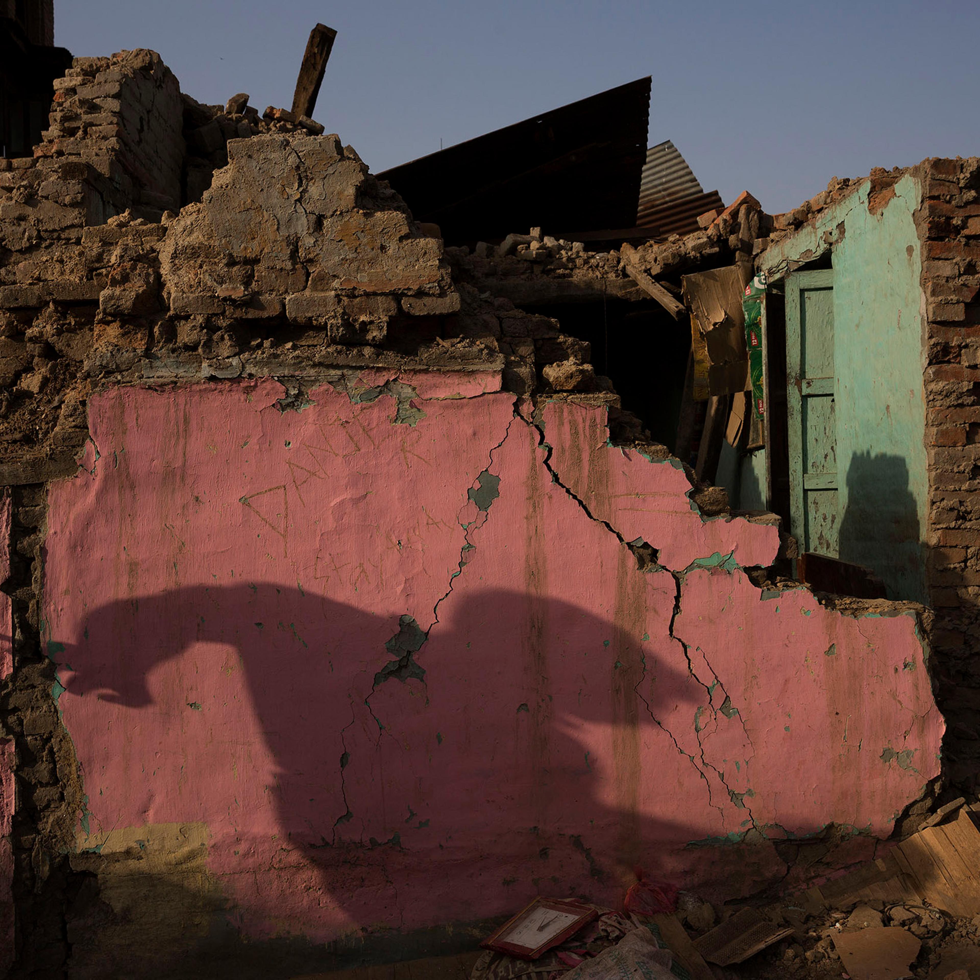 Nepal earthquake. Town of Sankhu. Mush of town was destroyed. People digging out their possessions. by James Nachtwey