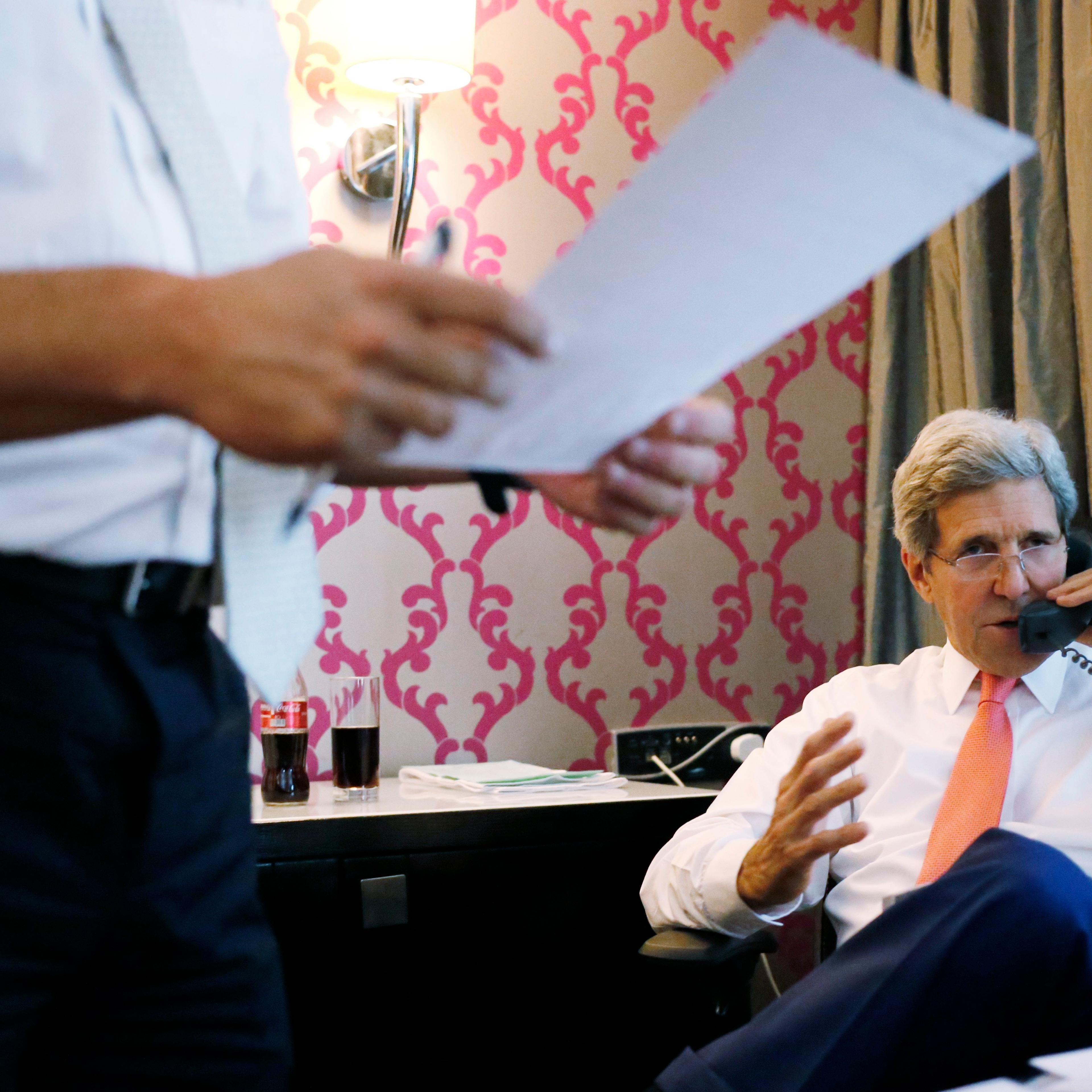 U.S. Secretary of State John Kerry talks to Israeli Prime Minister Benjamin Netanyahu about terms of a cease-fire in fighting in Gaza between Israel and Hamas on July 25, 2014.