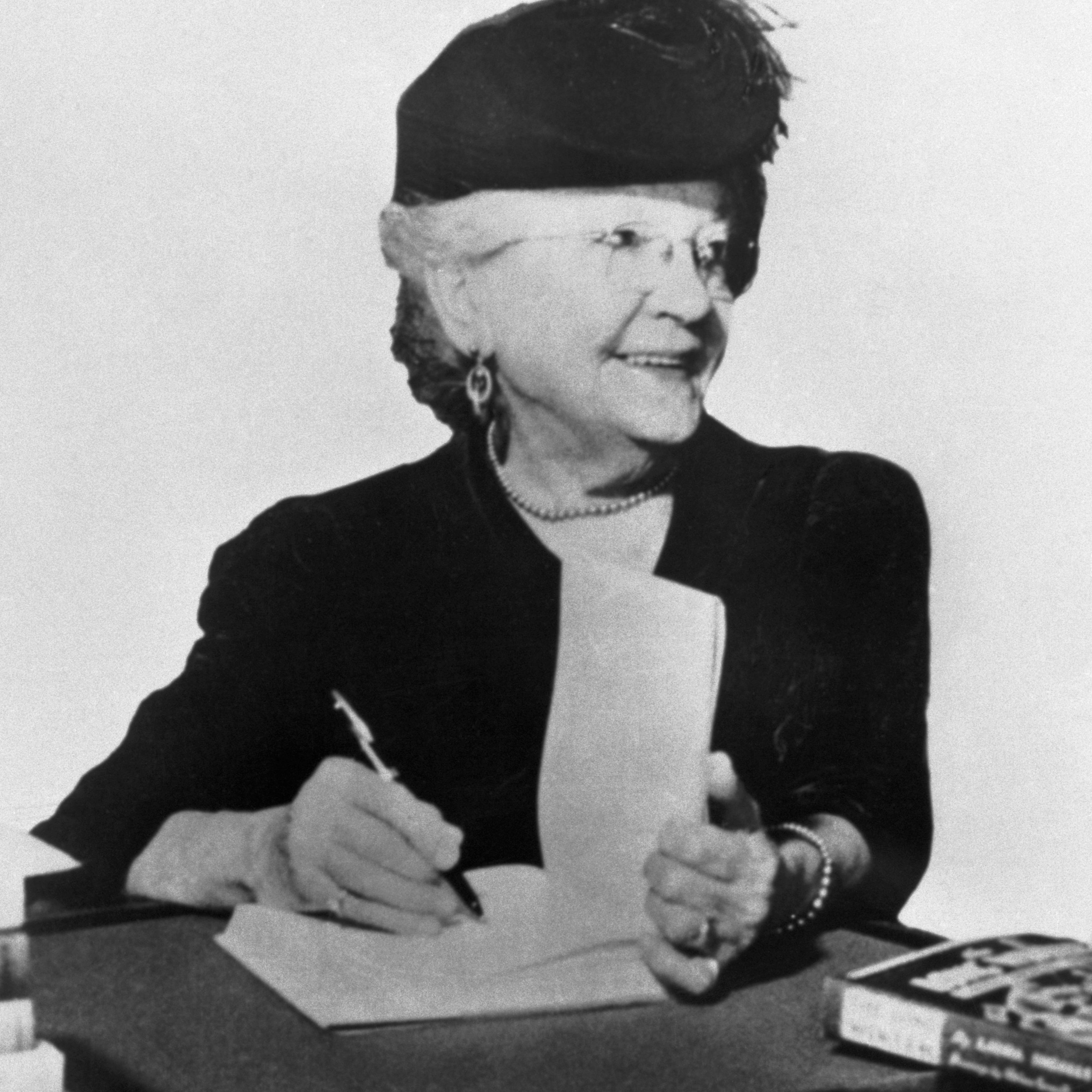 Laura Ingalls Wilder signing books ca. 1930s-1940s.