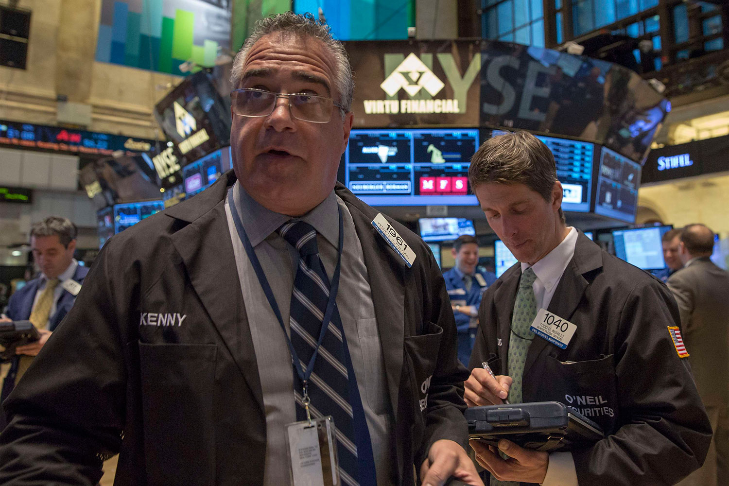 Traders work on the floor of the New York Stock Exchange