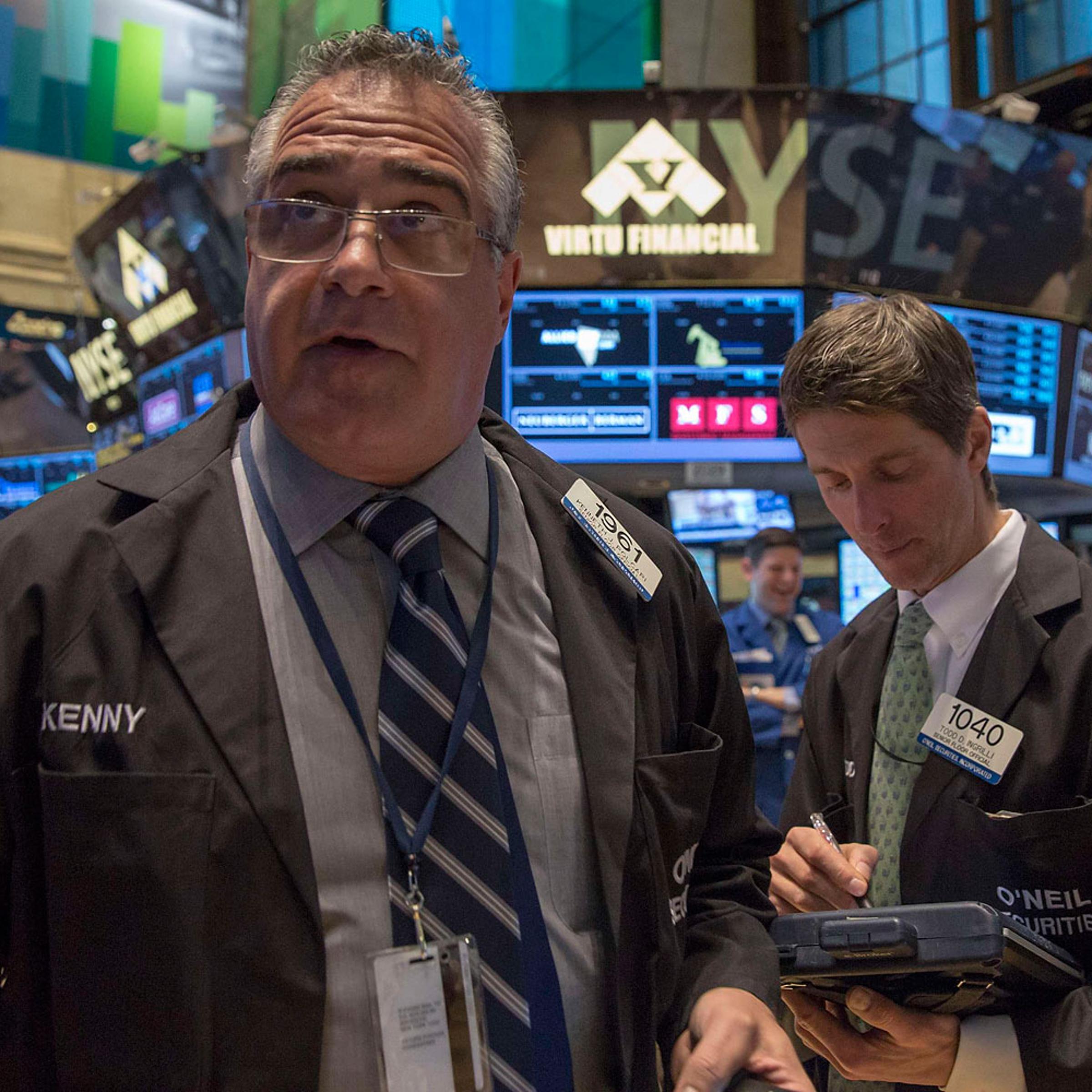 Traders work on the floor of the New York Stock Exchange