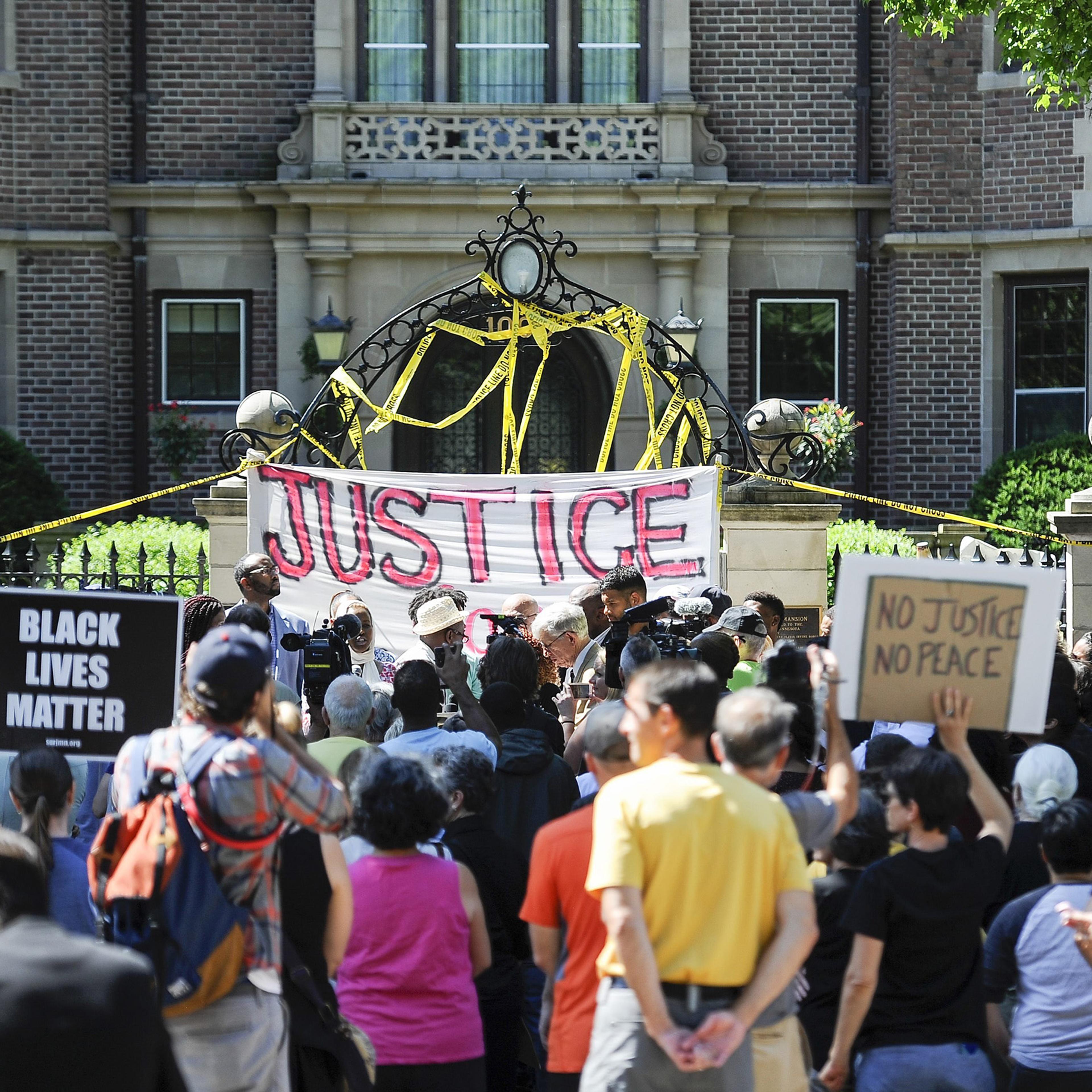 Protesters gather in front of the governor's residence in reaction to the the police shooting of Philando Castile in St. Paul, Minnesota, July 7, 2016.