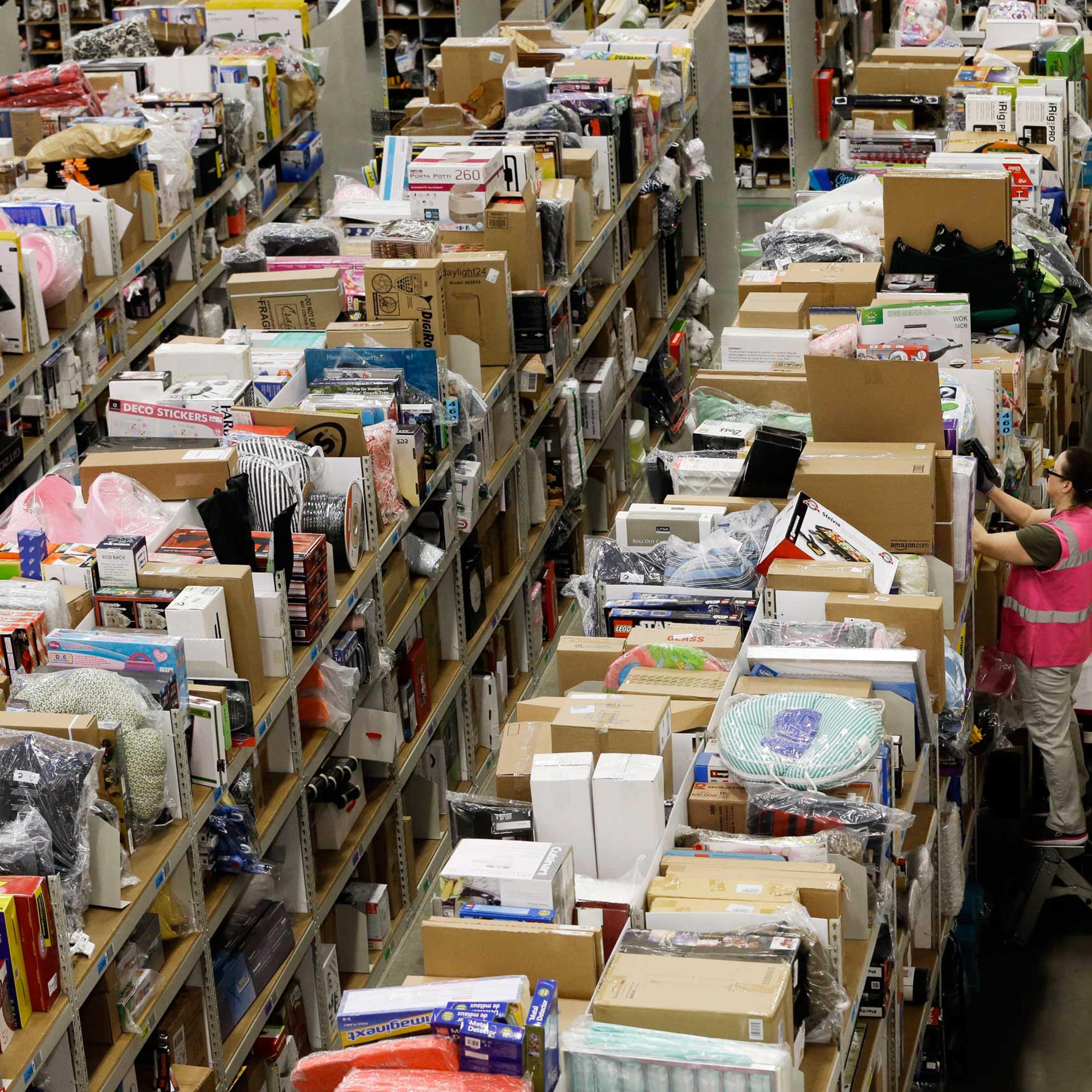 A worker fills orders at the Amazon fulfillment center on Cyber Monday, Dec. 1, 2014, in Lebanon, Tenn.