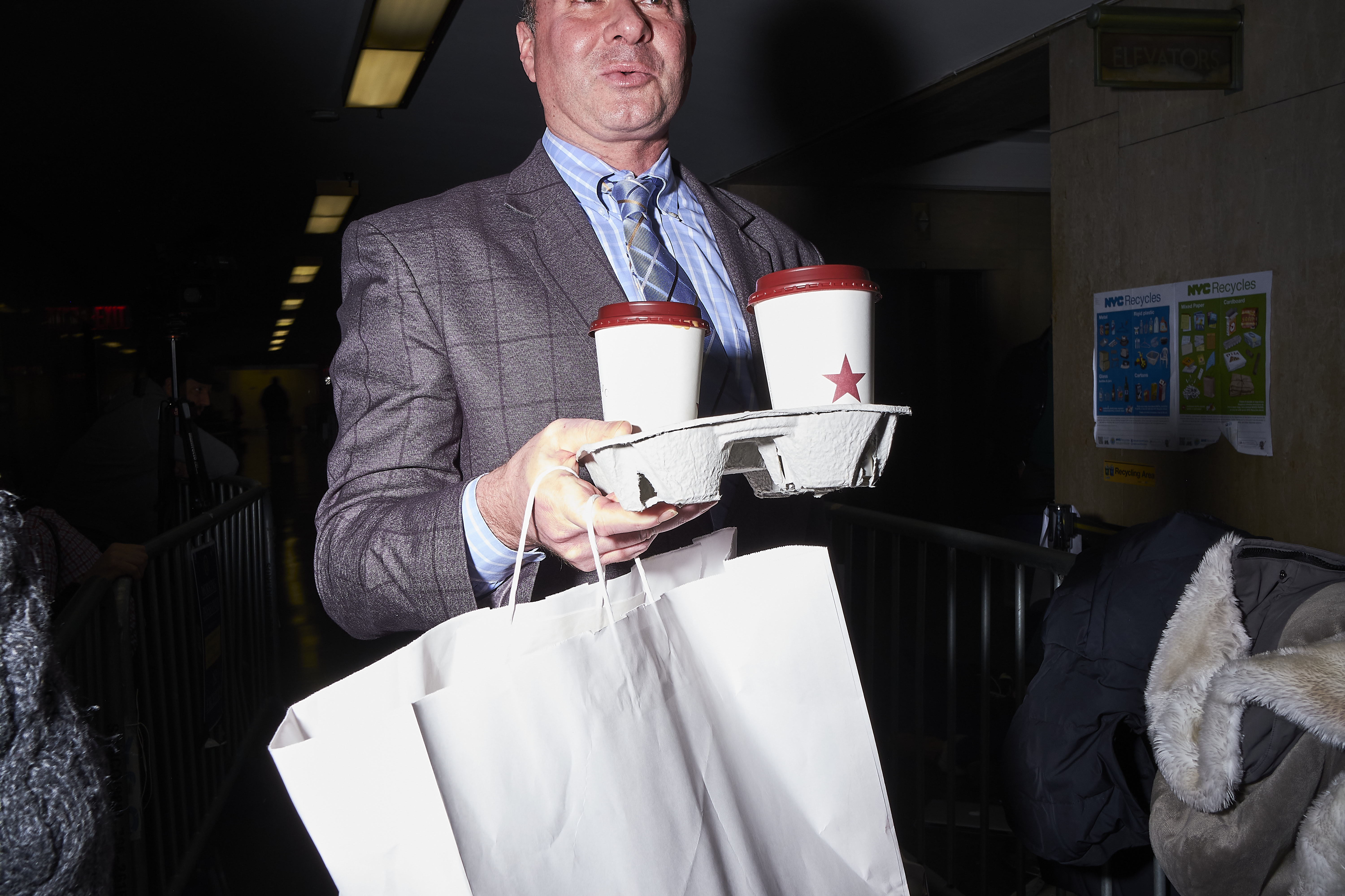 A member of Harvey Weinstein's legal team delivers lunch to Weinstein in the courtroom on Jan. 22, 2020.