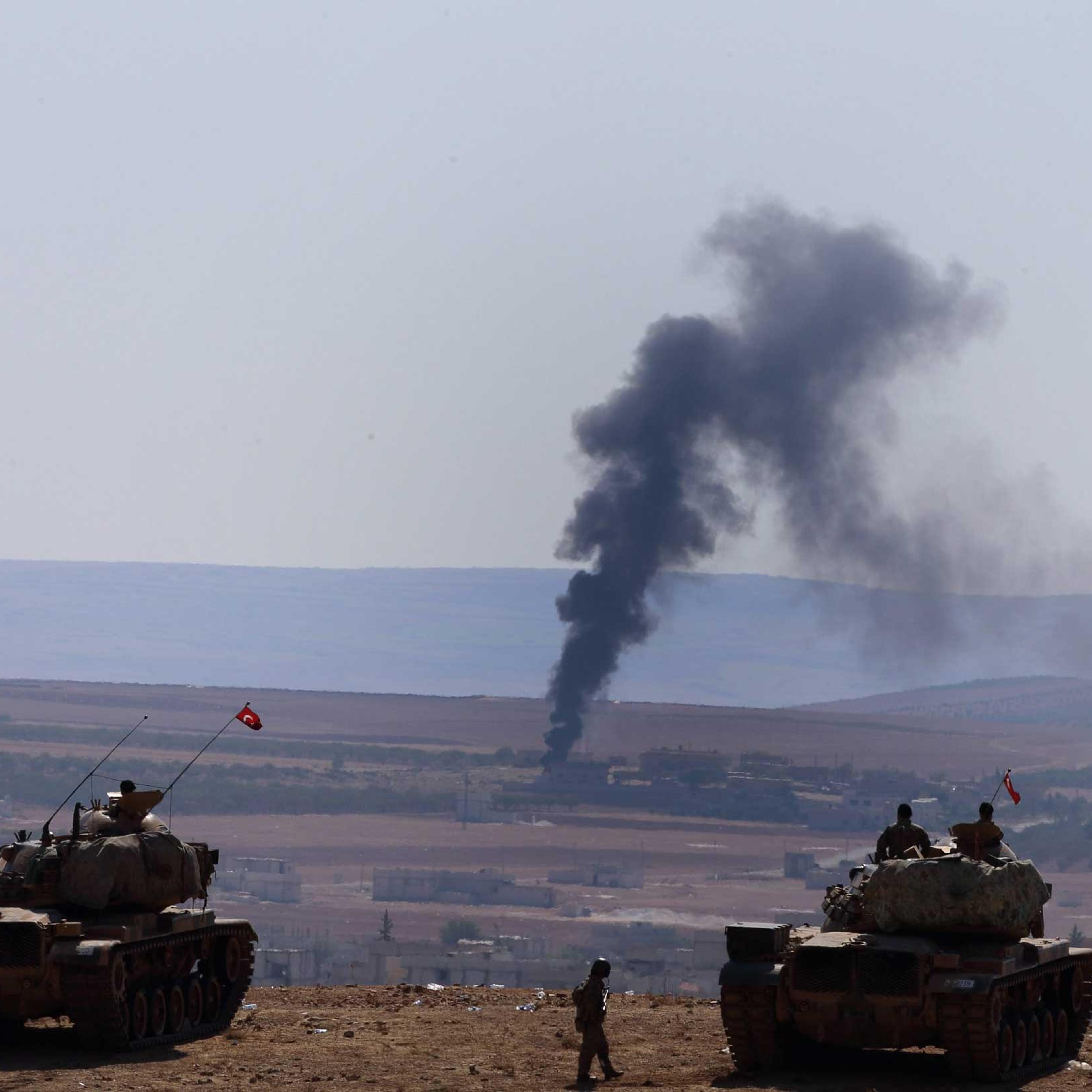 A picture taken from Turkey shows smoke rising after an airstrike by an alleged alliance war plane on the ISIS targets in the west of Kobane, Syria, where Kurdish fighters are trying to defend the city, near Suruc district, Sanliurfa, Turkey, Oct. 8, 201