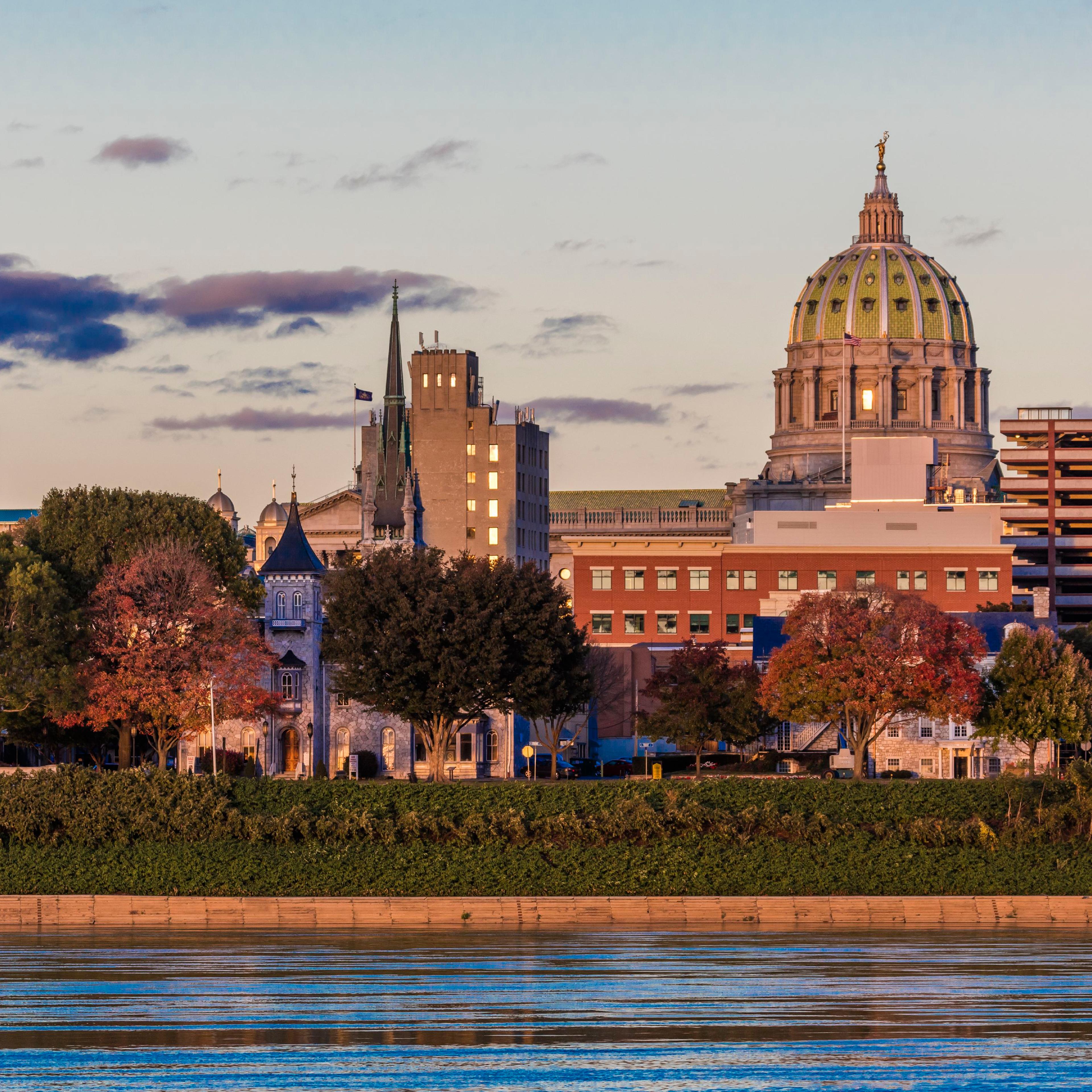 Harrisburg, Pennsylvania, City skyline and State Capitol at dusk from Susquehanna River