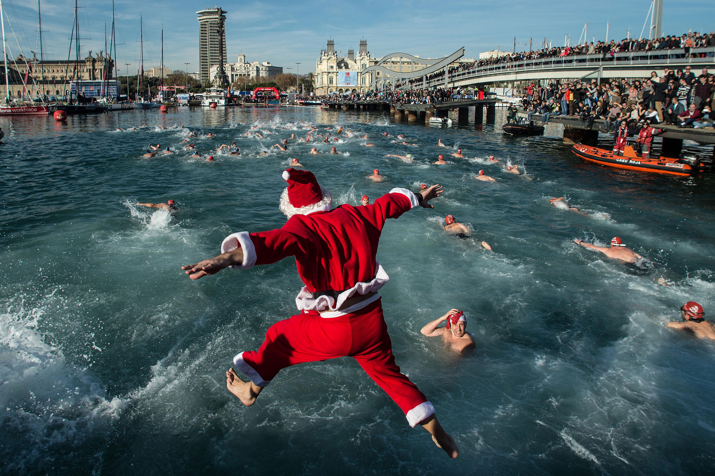 A competitor in Christmas fancy dress jumps into the sea during the 105th Barcelona Traditional Christmas Swimming Cup at the Old Harbour of Barcelona on Dec. 25, 2014 in Barcelona, Spain. The Copa Nadal is organised by the Barcelona Swimming Club and in