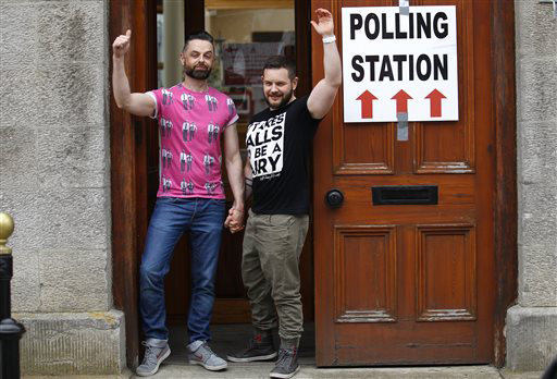 Partners Adrian, left and Shane, arrive to cast their vote at a polling station in Drogheda, Ireland