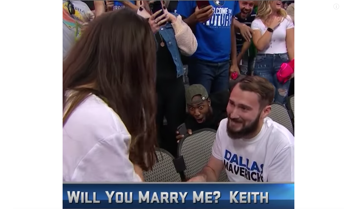 This photo taken from video shows Jonathan Miller's excited reaction to the wedding proposal at the Dallas Mavericks game on Sunday, Oct. 28, 2018. 