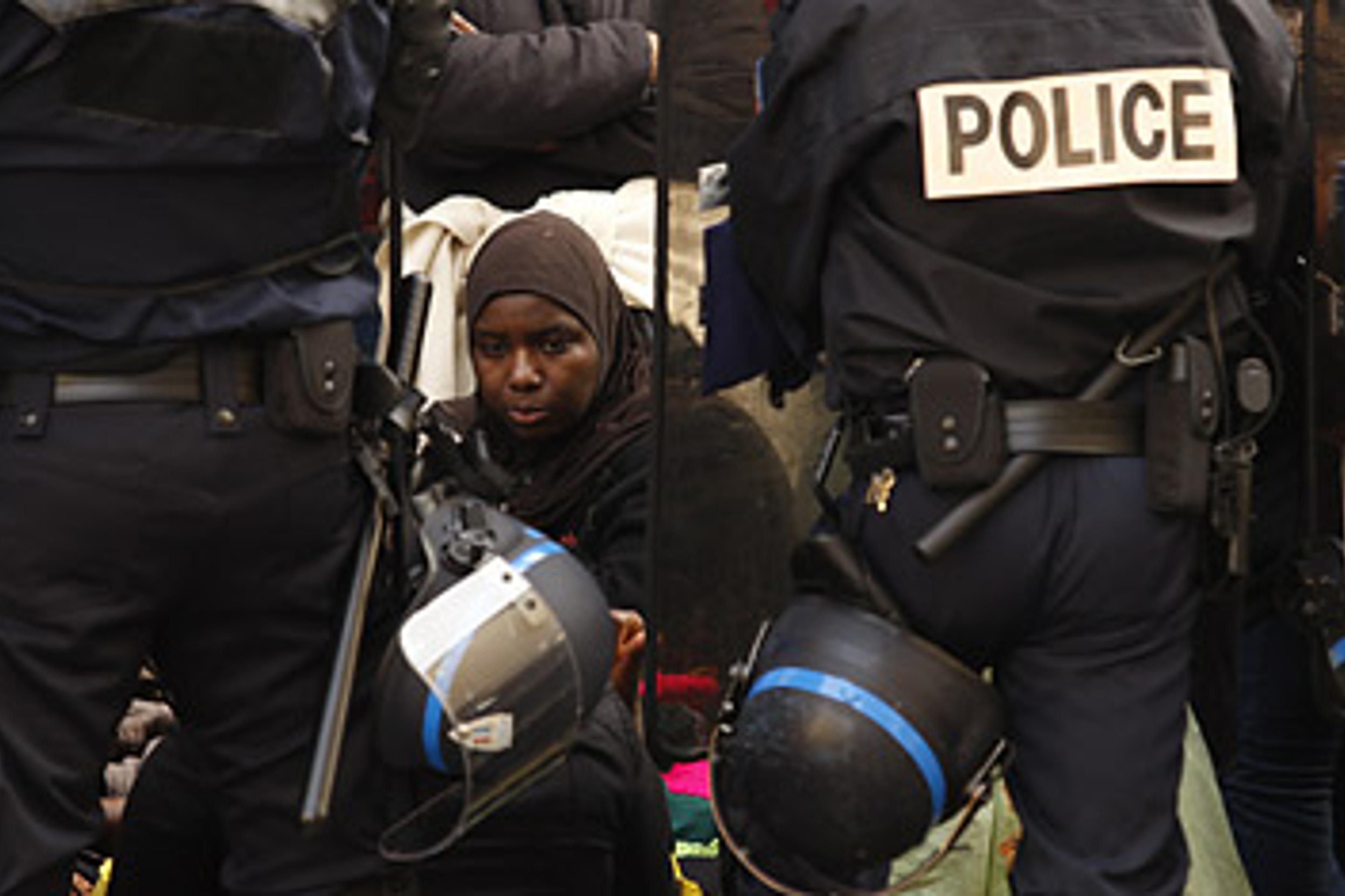 A homeless person surrounded by police in Paris, France