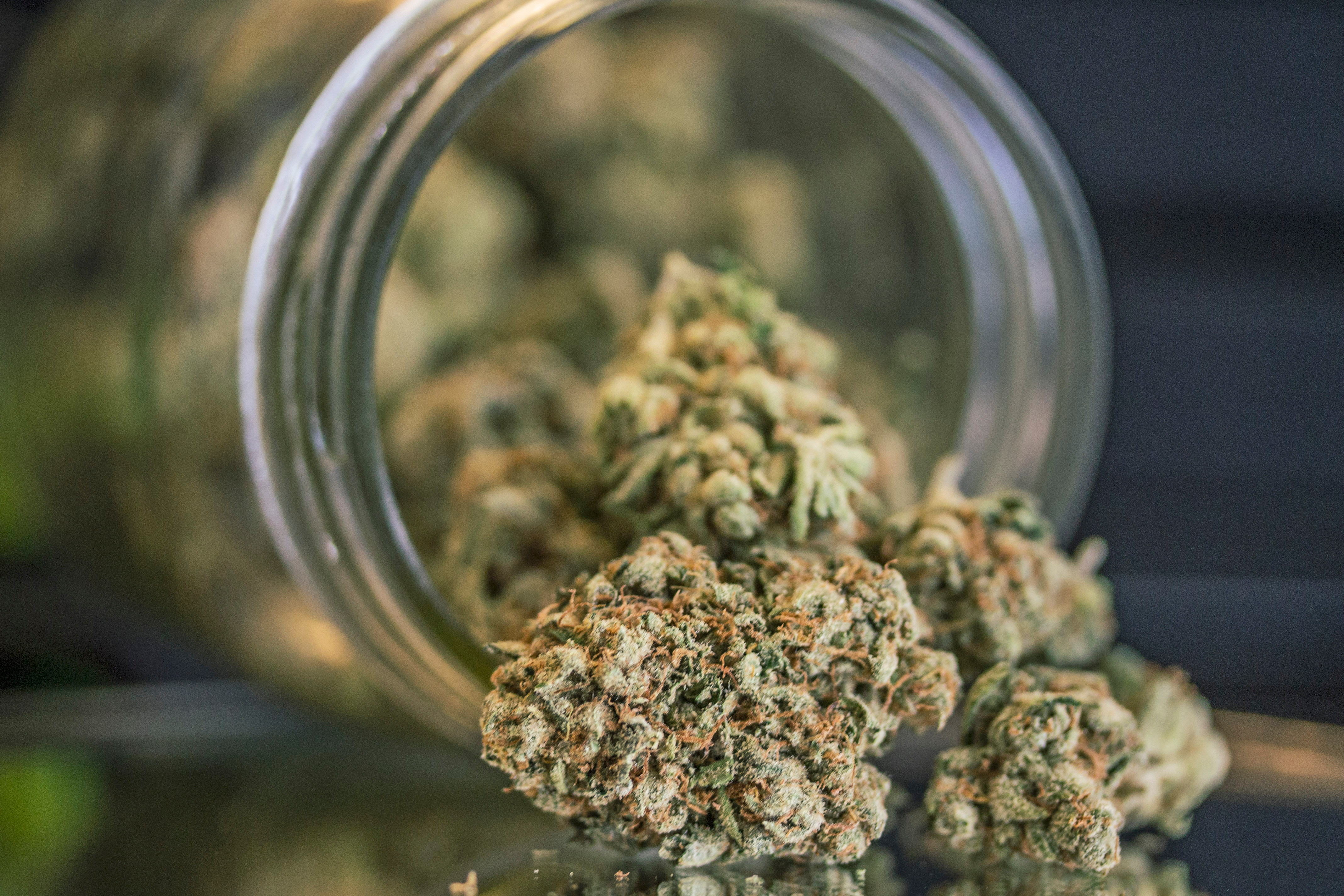 Close-Up Of Weed Porn In Mason Jar On Table