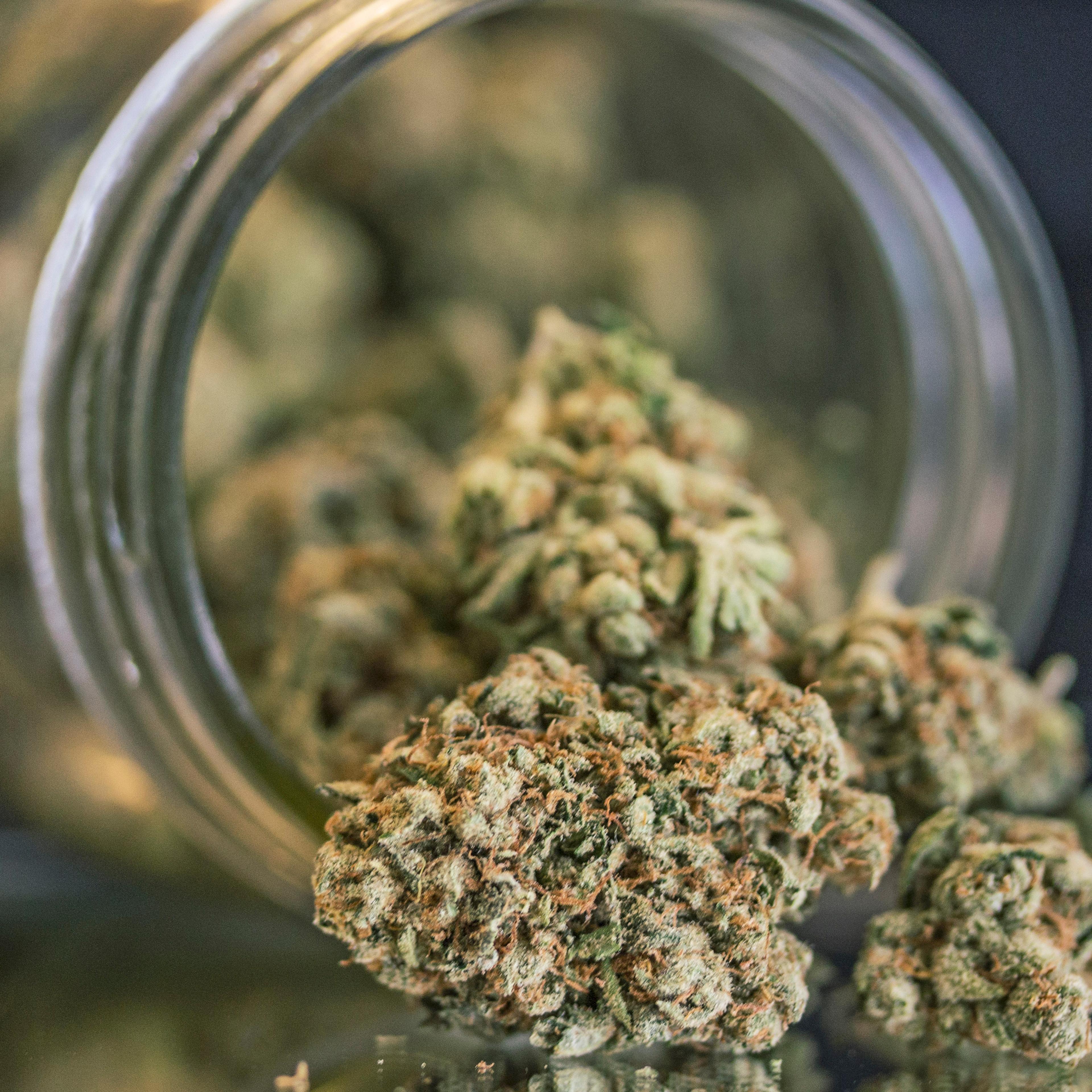 Close-Up Of Weed Porn In Mason Jar On Table