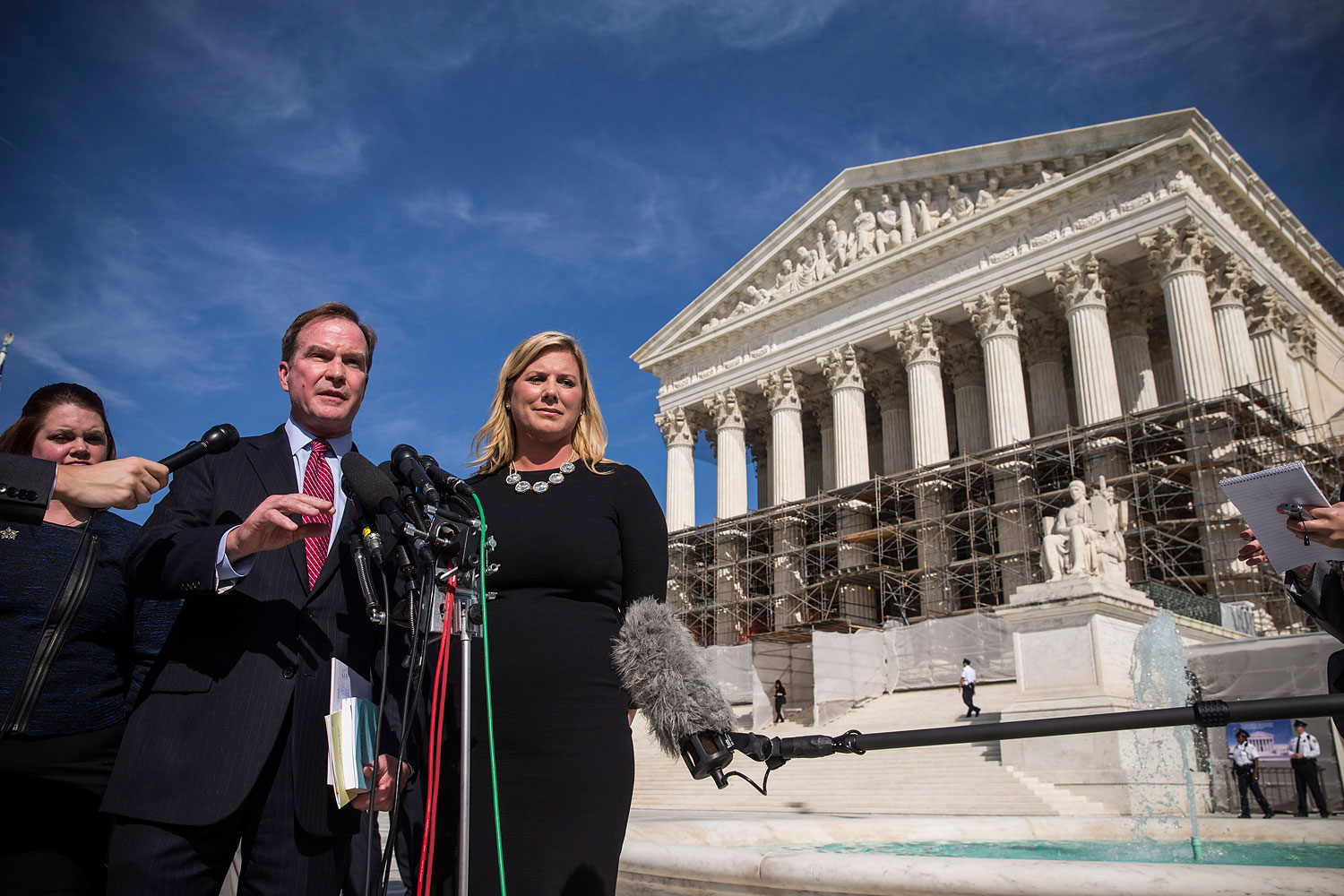 Jennifer Gratz, right, CEO of XIV Foundation and Michigan Attorney General Bill Schuette speak during a press conference outside the Supreme Court after going before the Supreme Court in "Schuette v. Coalition to Defend Affirmative Action" on Oct. 15, 20