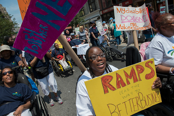 People participate in the first annual Disability Pride Parade in New York City on July 12, 2015.