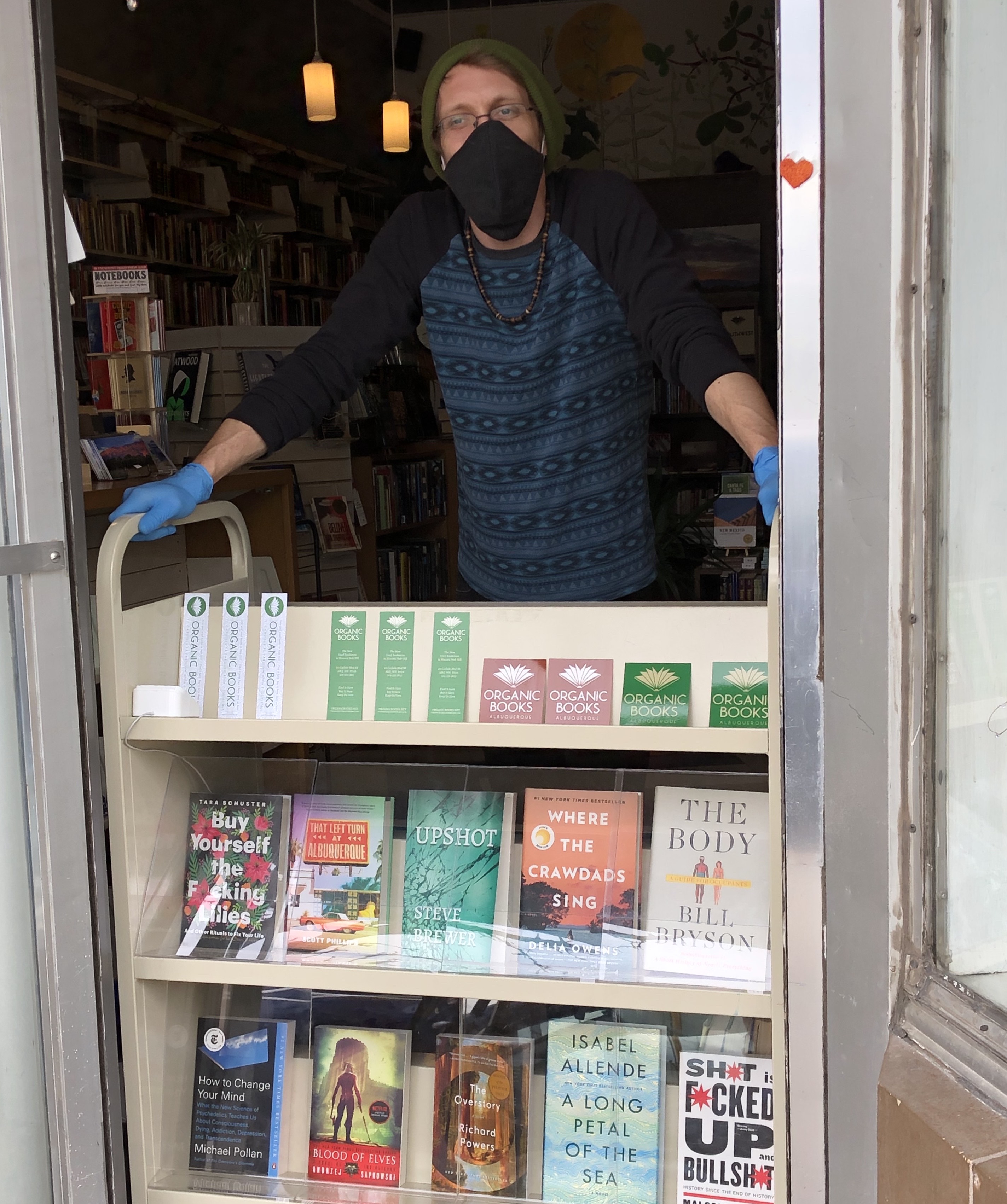 Seth Brewer, a co-owner of Organic Books in Albuquerque, New Mexico, at his bookstore before a stay-at-home order closed it down. 