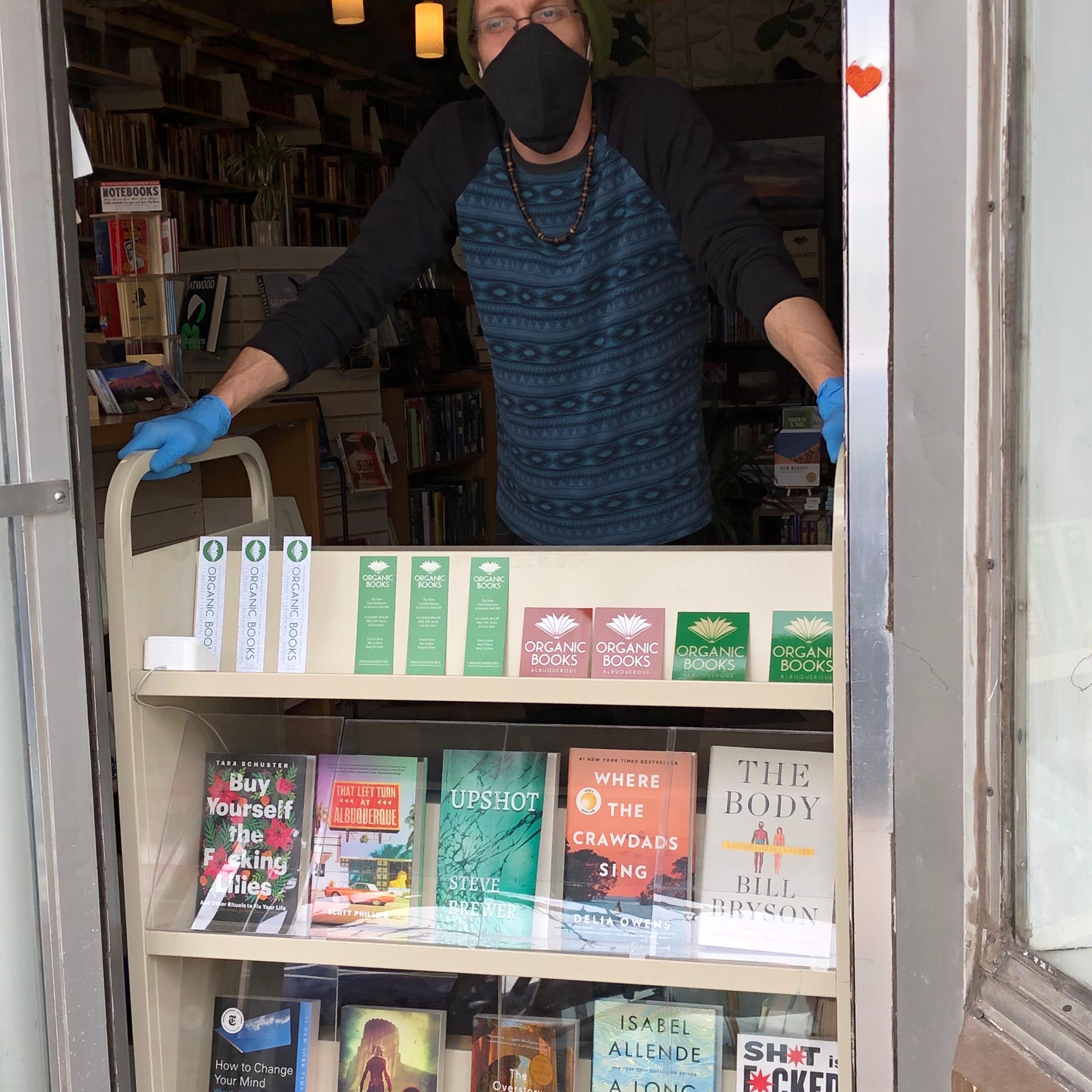 Seth Brewer, a co-owner of Organic Books in Albuquerque, New Mexico, at his bookstore before a stay-at-home order closed it down.