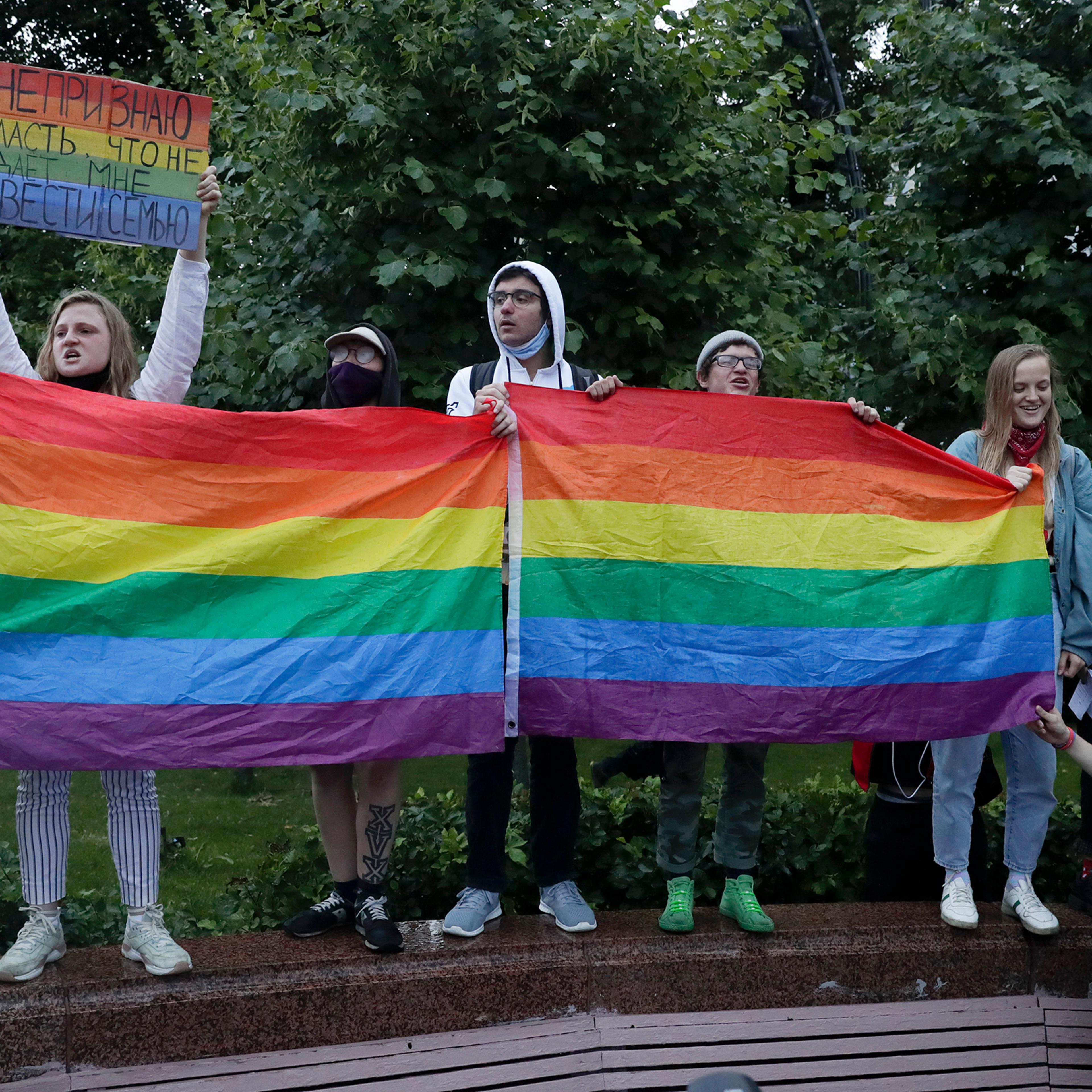 LGBT activists rally in Moscow's Pushkin Square on July 15, 2020. The poster reads: "I don't accept power that does not allow me to have a family!"