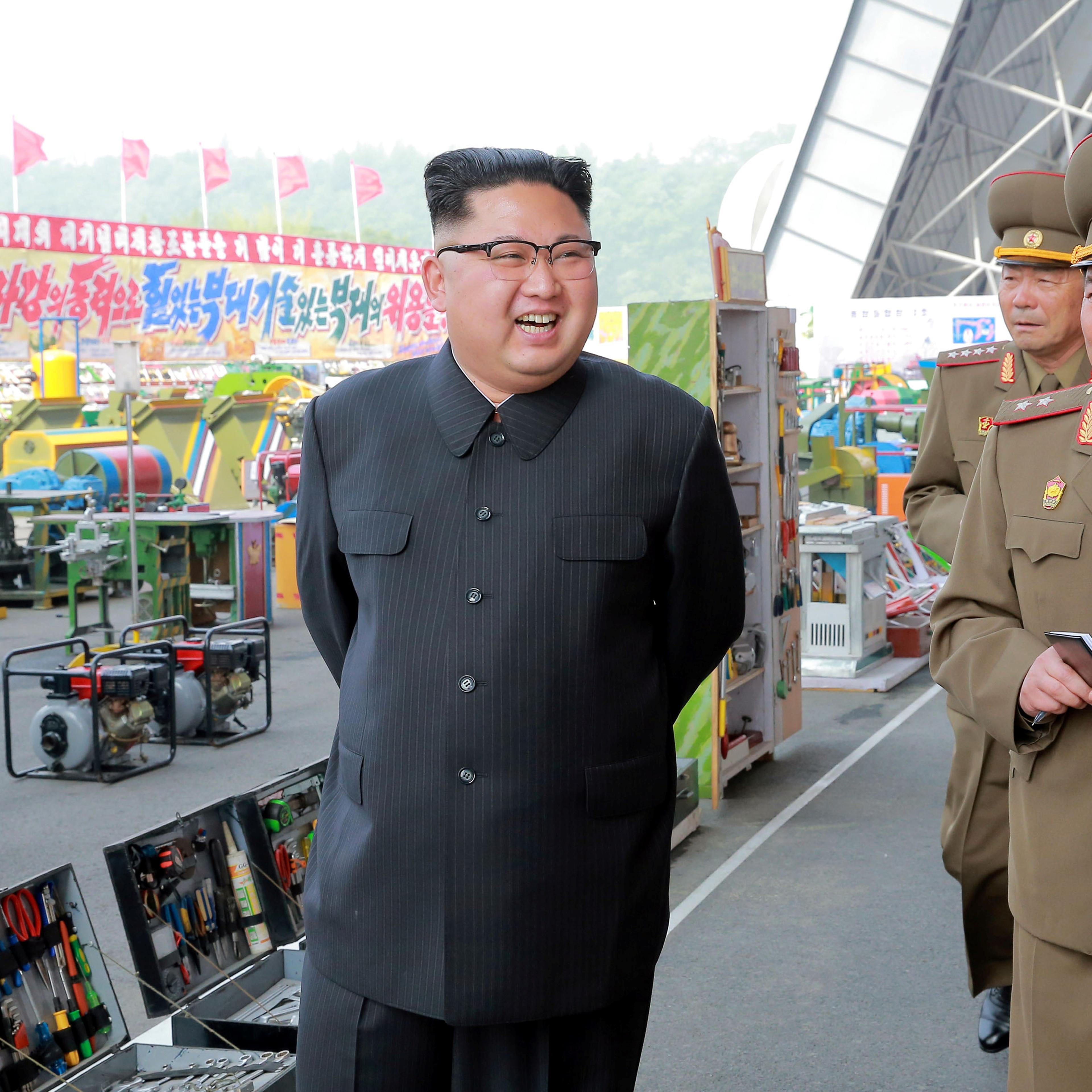 North Korean leader Kim Jong Un visits the exhibition of utensils and tools, finishing building materials and sci-tech achievements organised by the Ministry of the People's Armed Forces