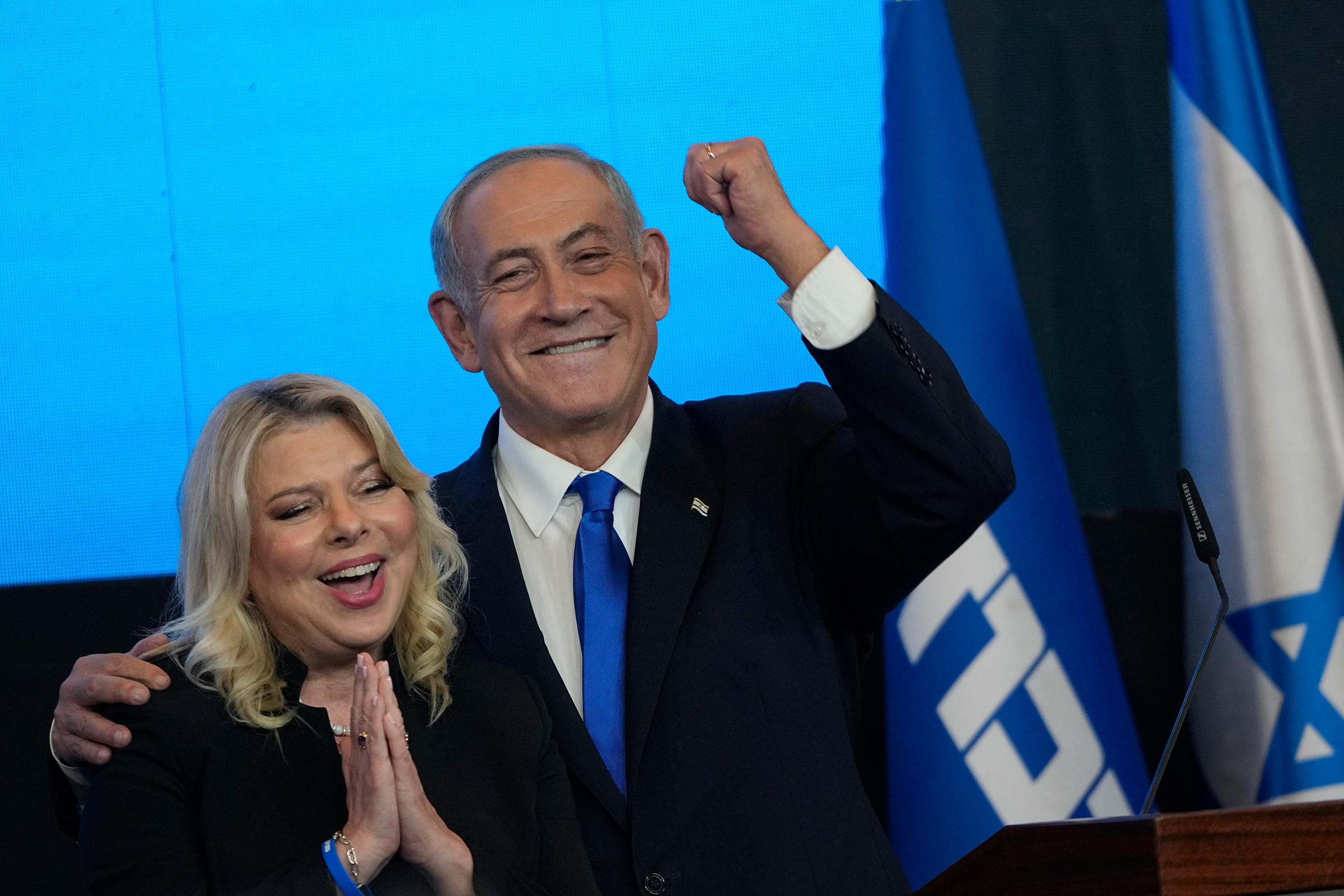 Former Israeli Prime Minister Benjamin Netanyahu and his wife Sara gesture after first exit poll results for the Israeli Parliamentary election on Nov. 2.