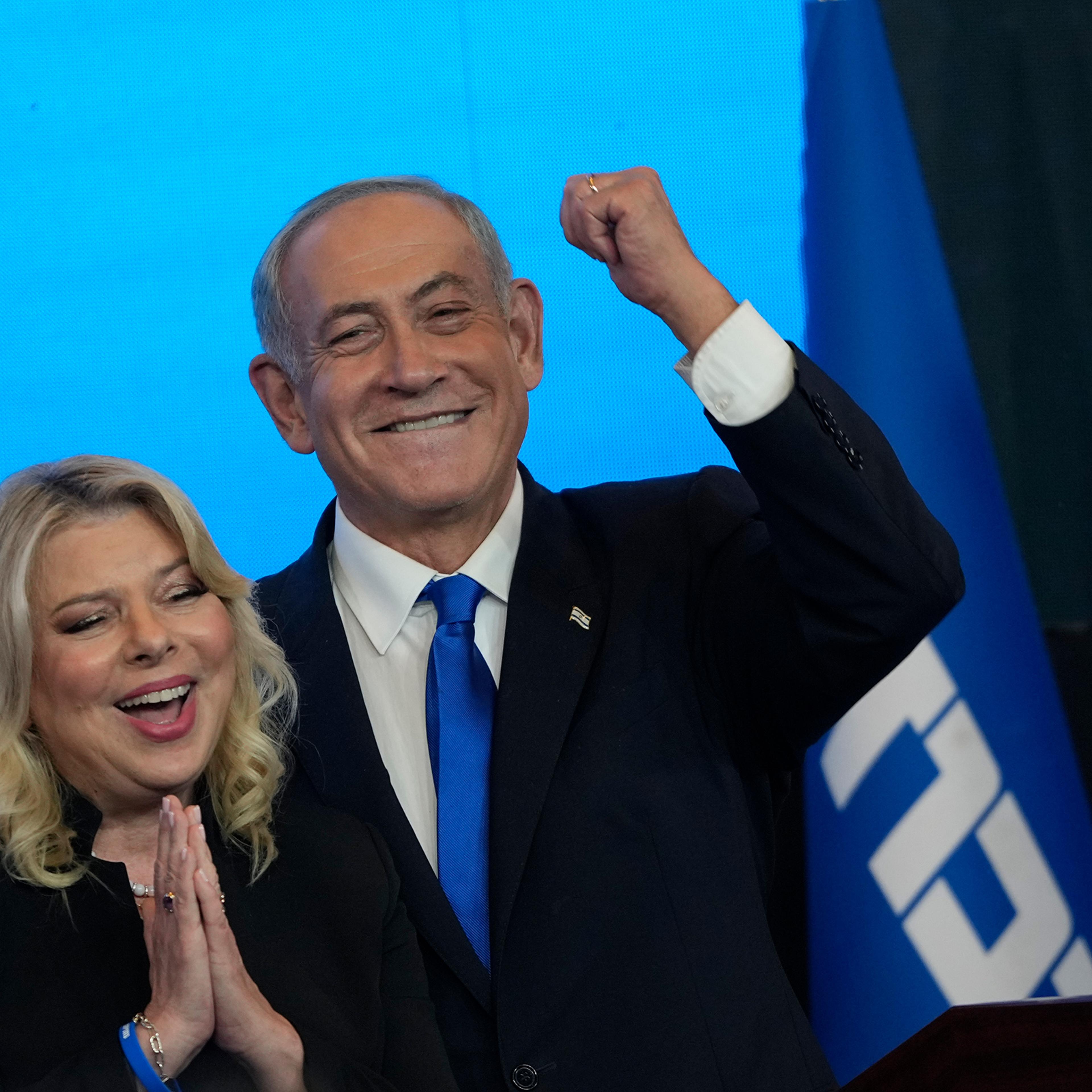Former Israeli Prime Minister Benjamin Netanyahu and his wife Sara gesture after first exit poll results for the Israeli Parliamentary election on Nov. 2.