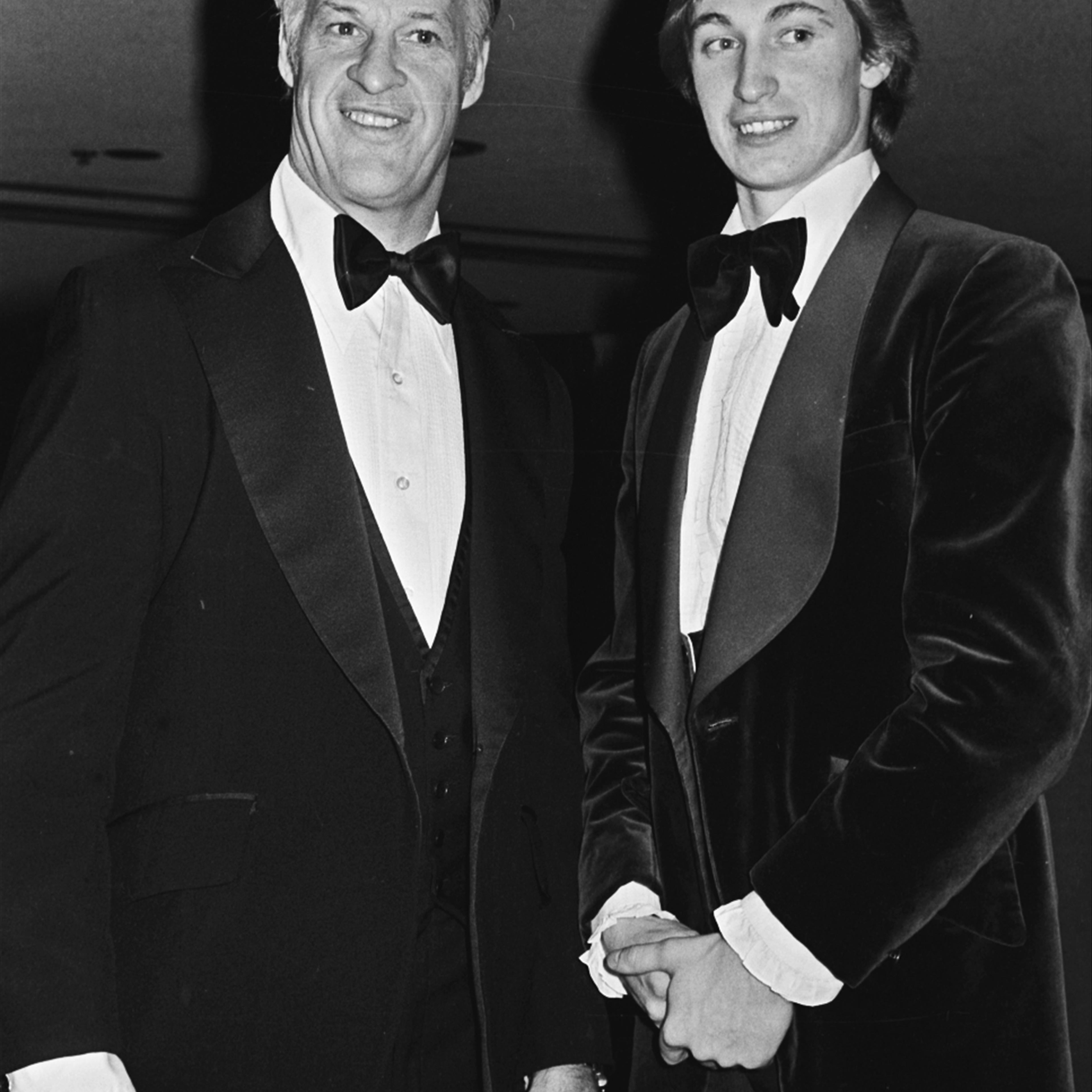 Gordie Howe, left, of the Hartford Whalers, and Wayne Gretzky of the Edmonton Oilers, pose for photographers at the NHL All-Star benefit dinner in Detroit, Feb. 5, 1980. Howe, 51, will play for the Prince of Wales Conference , and Gretzky, 19, will play