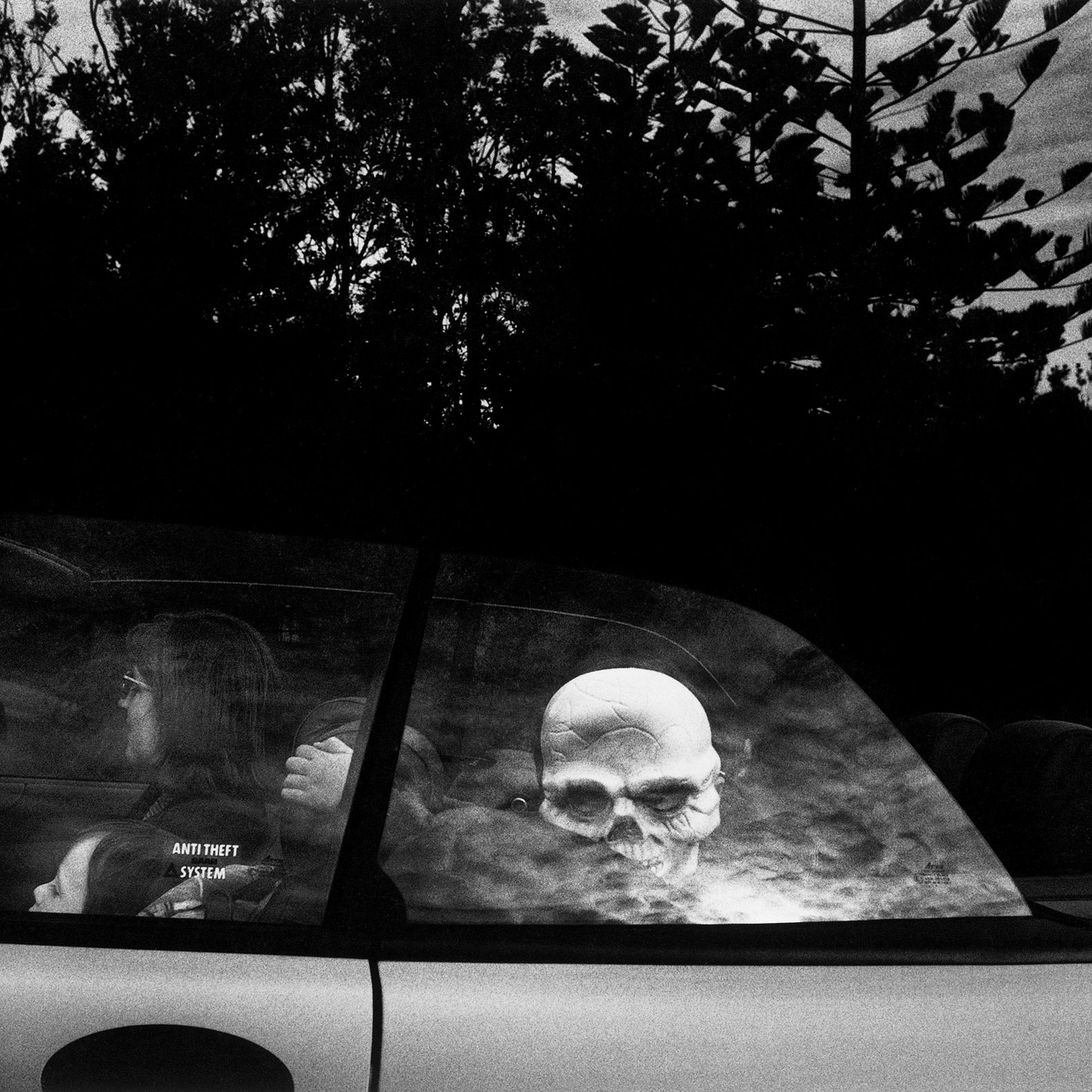 AUSTRALIA. Sydney. A child with a skeleton mask arrives at a fancy dress party in Watsons Bay. From Dream/Life series. 1998.