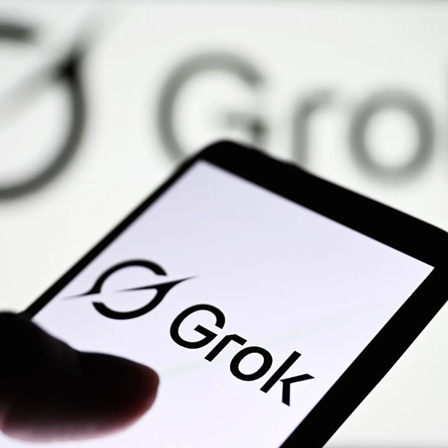 In this photo illustration, a Grok logo of a generative