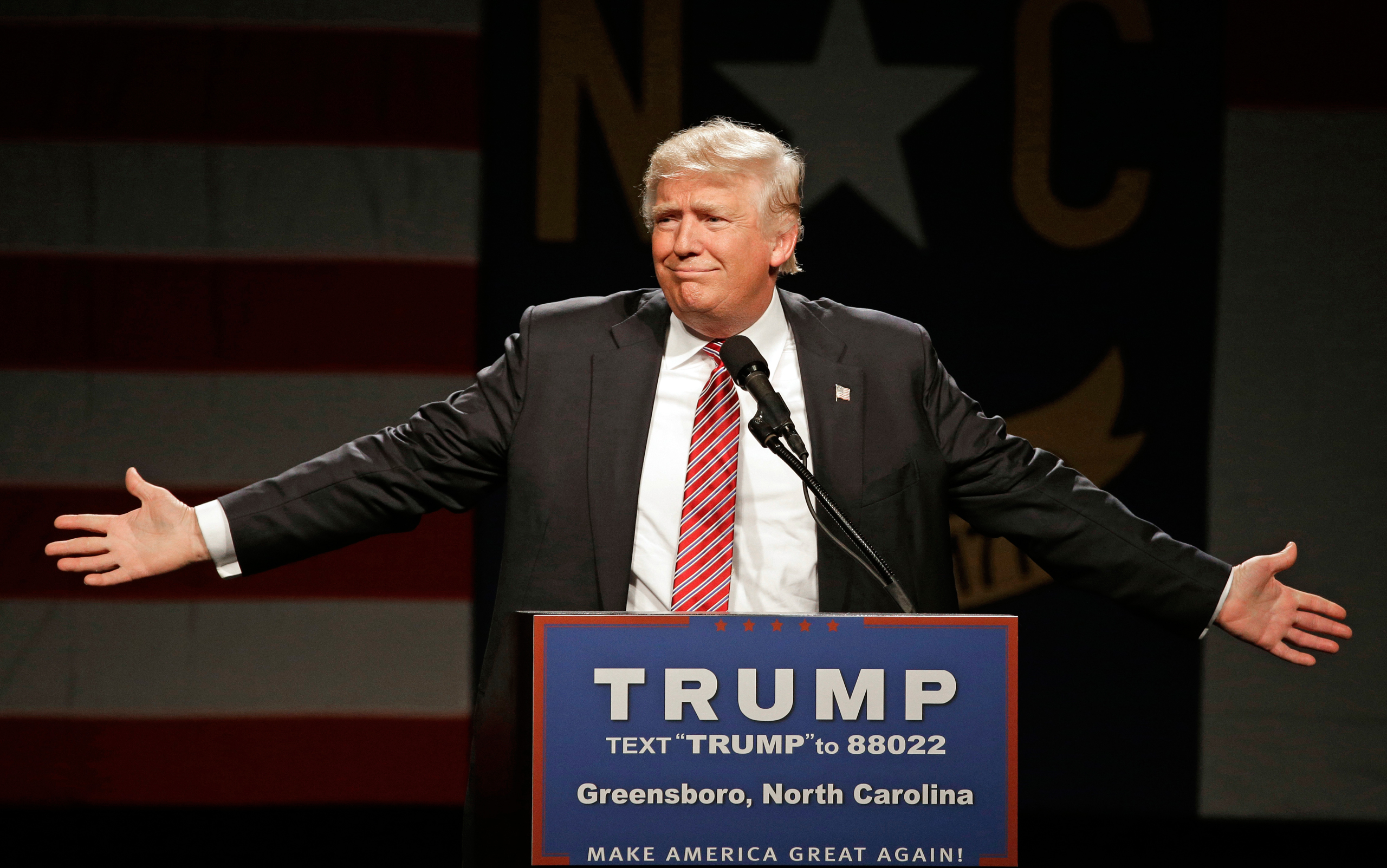 Republican presidential candidate Donald Trump gestures as he speaks during a campaign rally at the Greensboro Coliseum in Greensboro, N.C., Tuesday, June 14, 2016. (AP Photo/Chuck Burton)