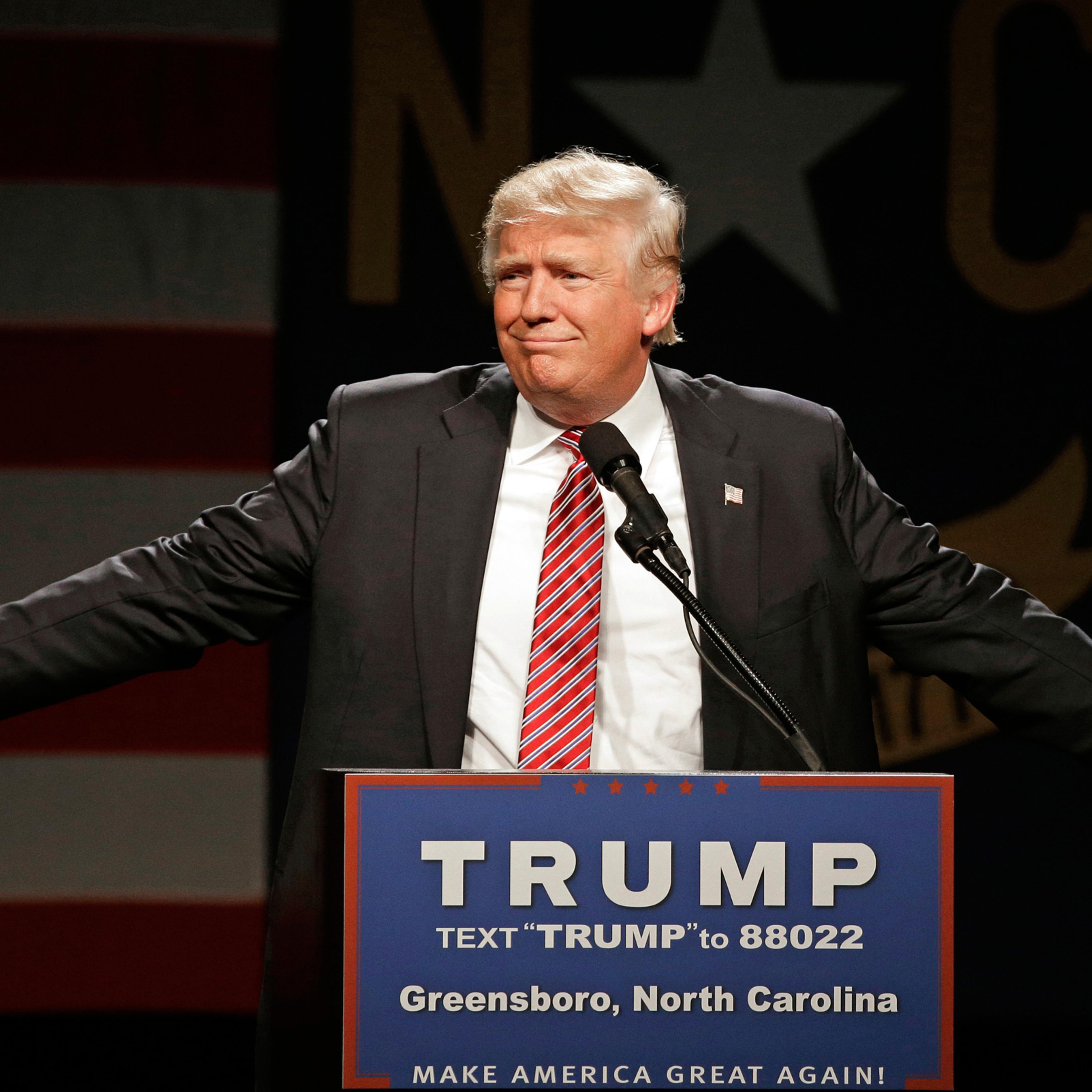 Republican presidential candidate Donald Trump gestures as he speaks during a campaign rally at the Greensboro Coliseum in Greensboro, N.C., Tuesday, June 14, 2016. (AP Photo/Chuck Burton)