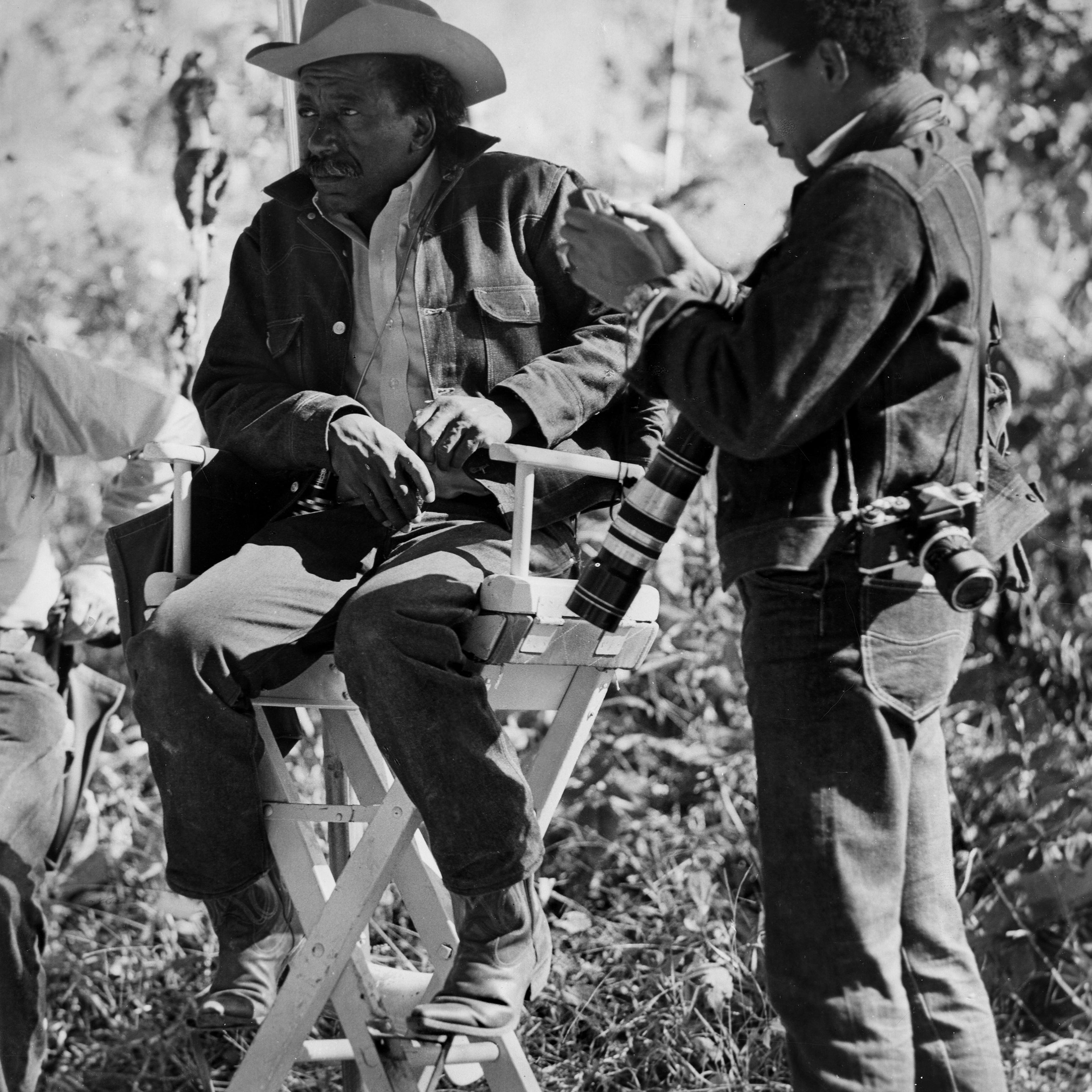 Publicity still portrait of American directors Gordon Parks Sr and his son Gordon Parks Jr on the set of the Warner Bros. film 'The Learning Tree,' circa 1969.